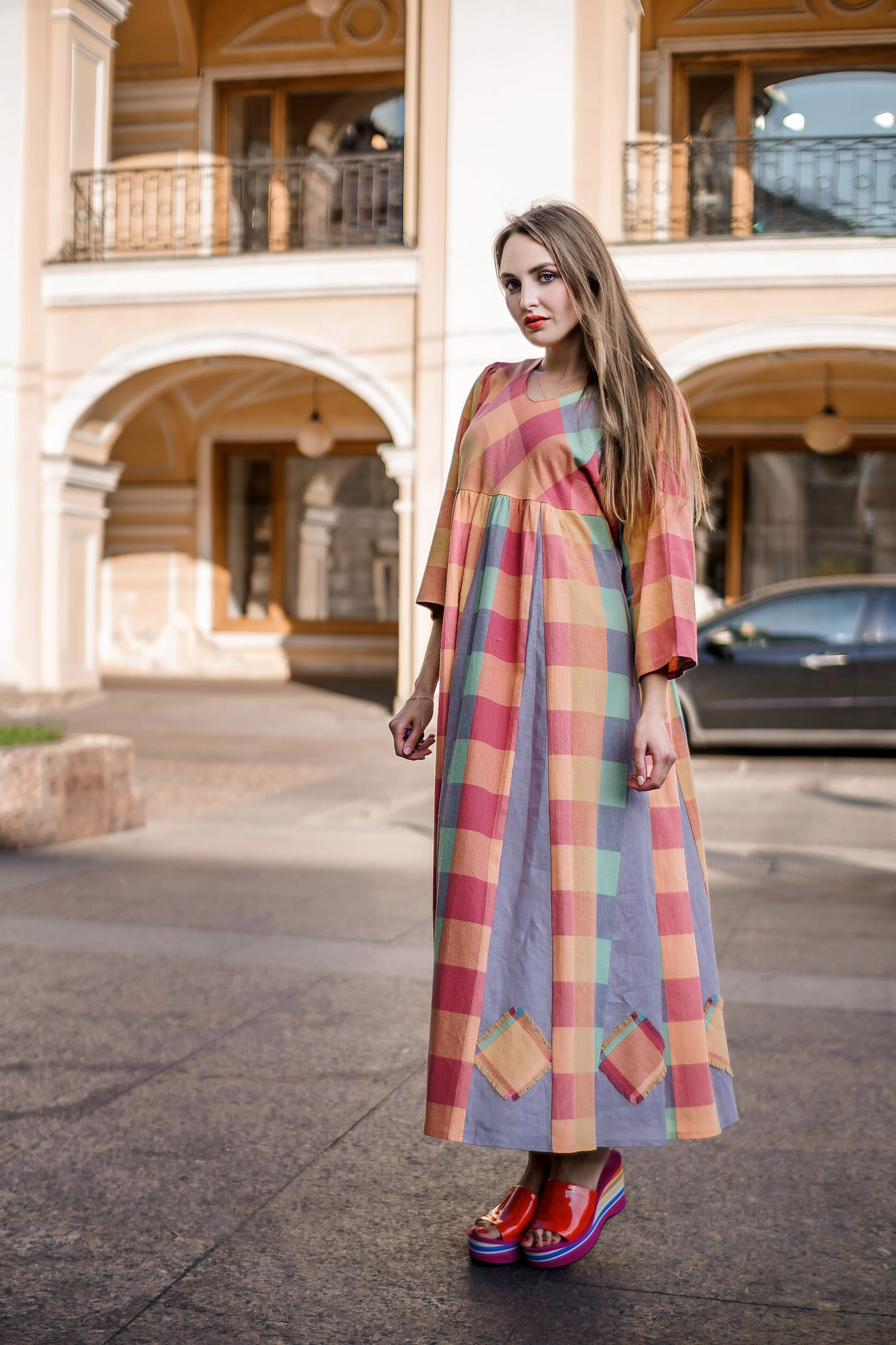 Woman in a long dress outdoors – commercial photo shoot showcasing the dress