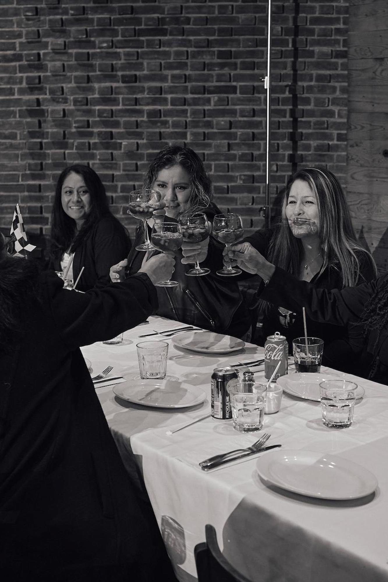 Women raising their glasses at a party