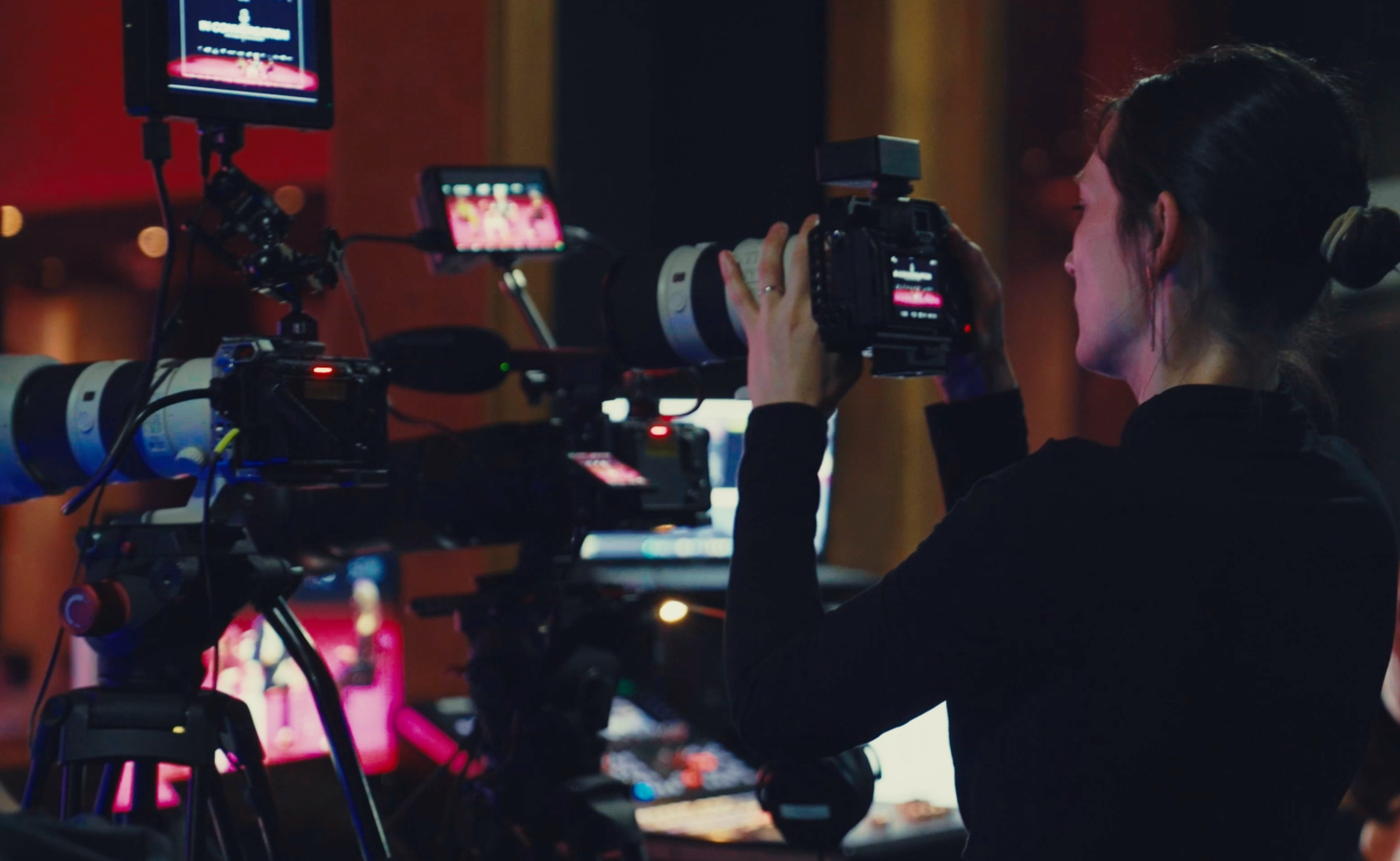 Videographer operating a multi-camera setup during a corporate event production in Dubai