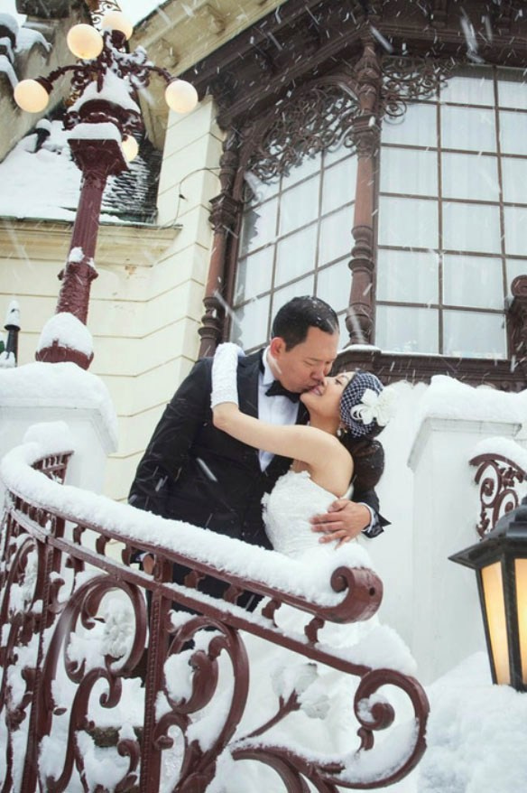 Young Hong Kong newlyweds run through the pigeons in front of St. Mark's Basilica shortly after sunrise in Venice.