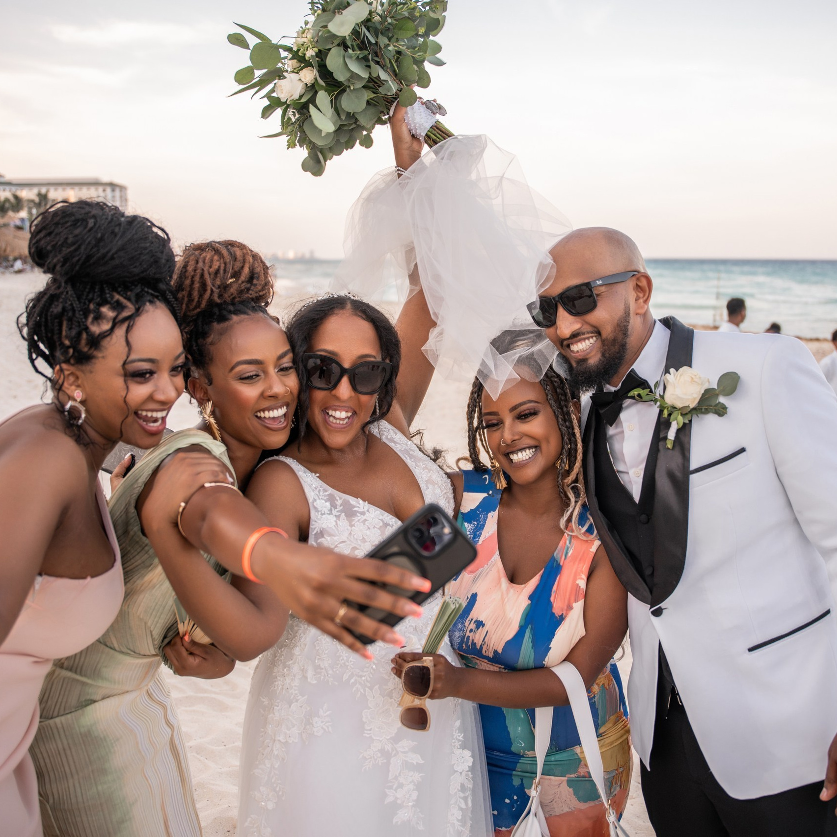 The bride, groom, and friends at a wedding in Playa del Carmen.