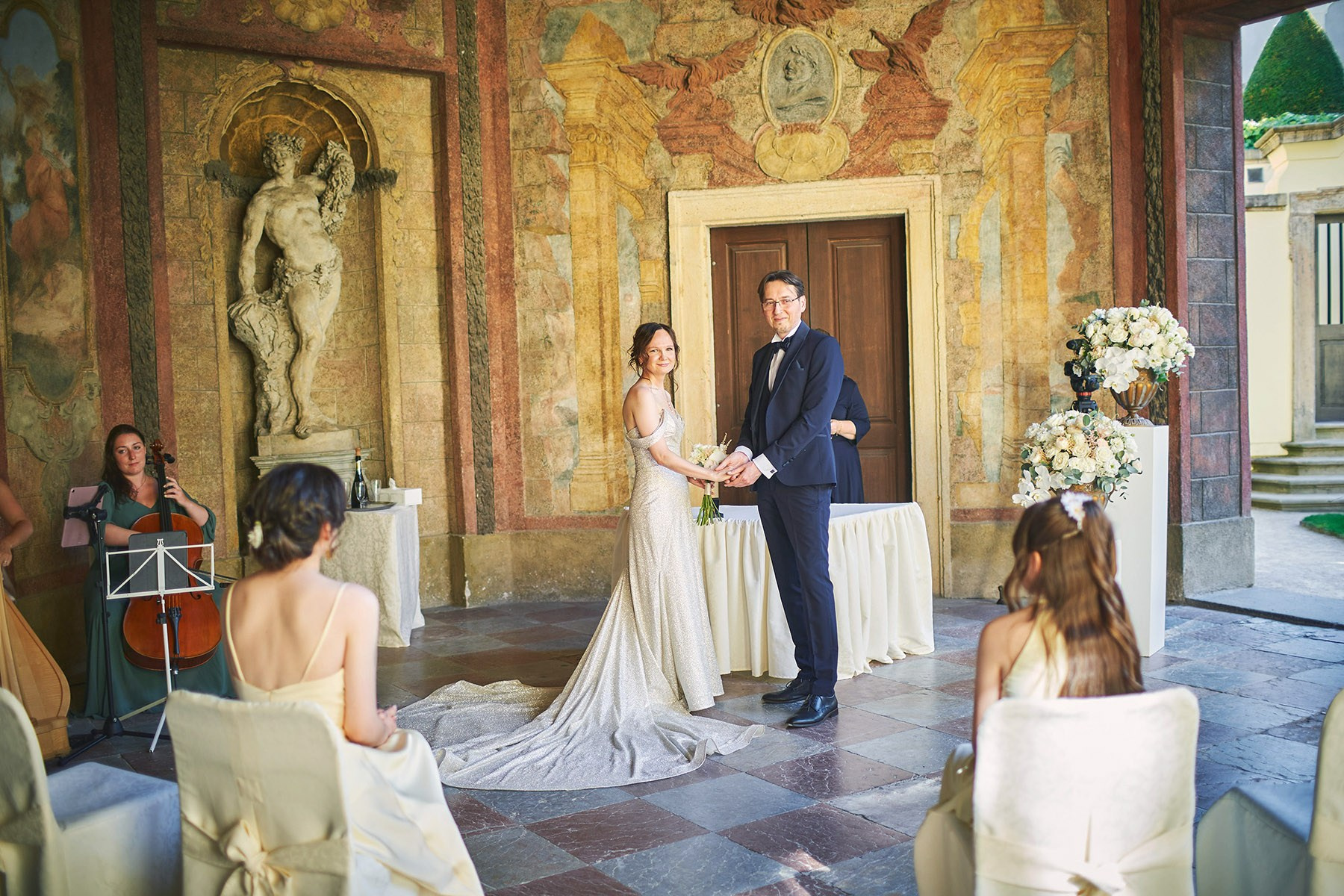 Vladimir and Ina, the harpsichordist and cellist, perform under the frescoes of the Sala Terrena at Vrtba Garden