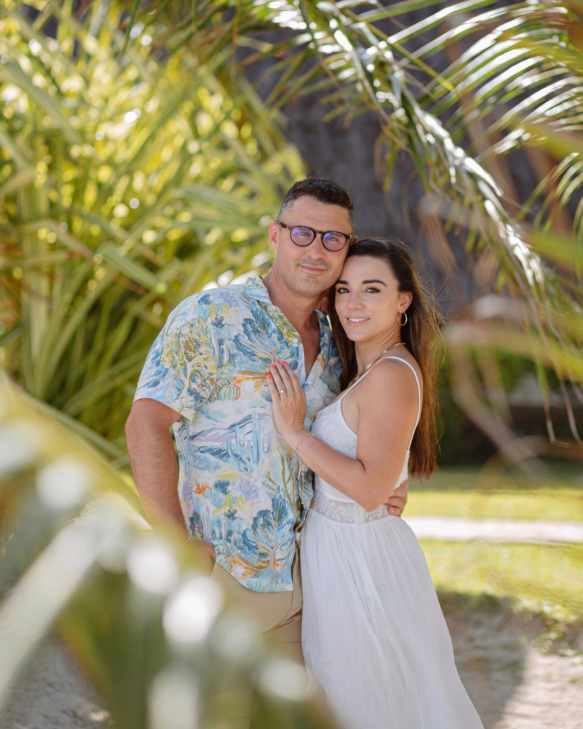 Couple portraits in Mombasa beach garden, intimate pre-wedding photography.