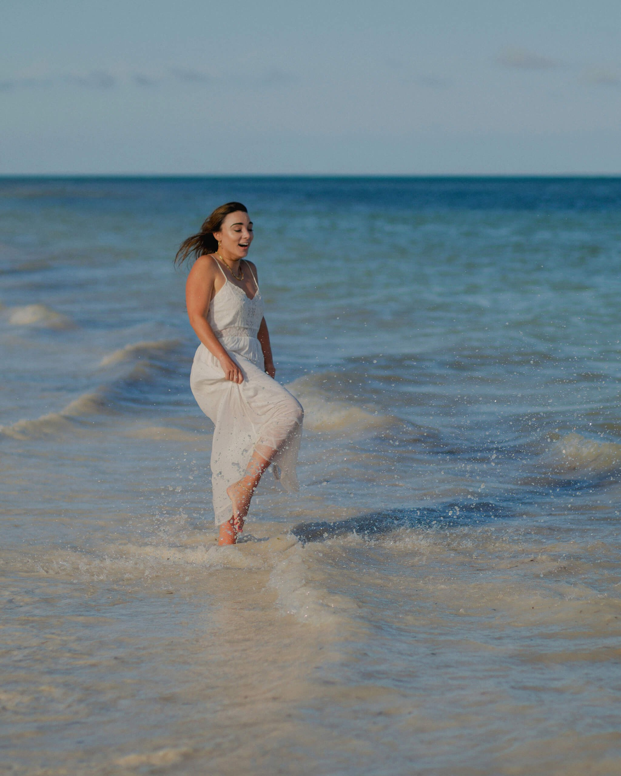 Solo bride portrait in beach water, Kenya photographer.