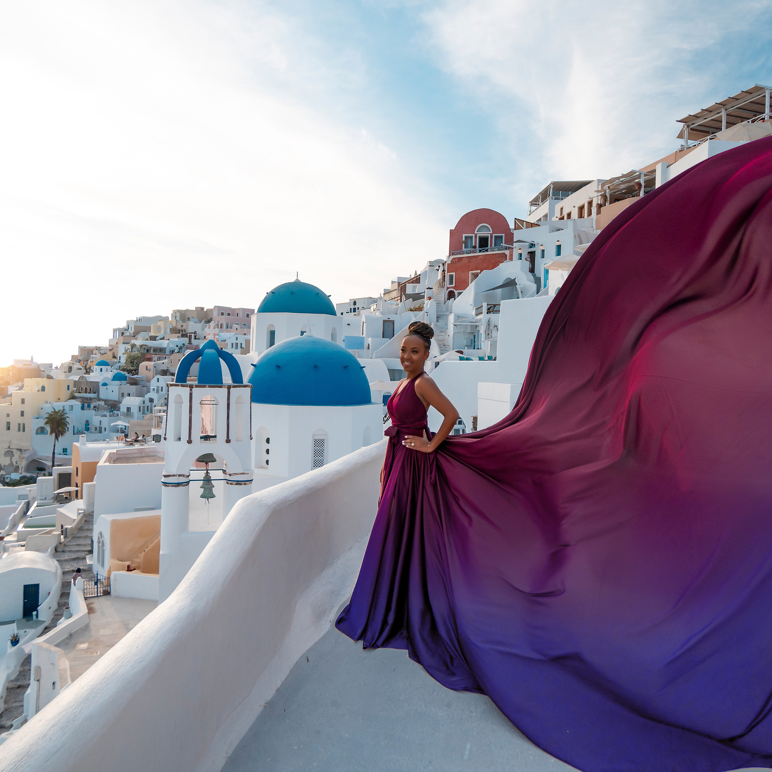 Photo session in&nbsp;Oia, Santorini at&nbsp;sunset, cherry dress