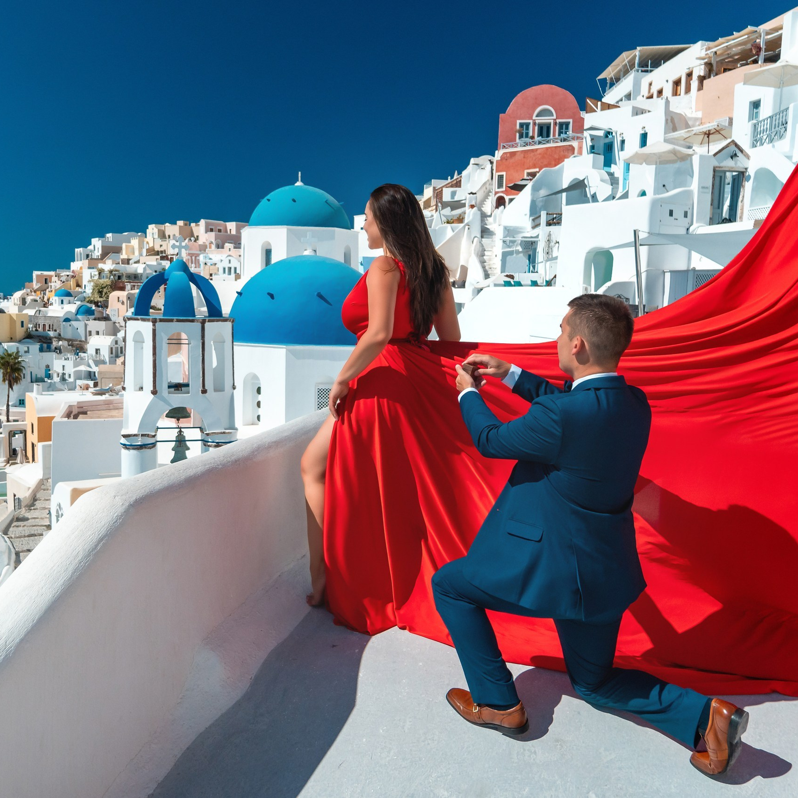 Ethereal Proposals: Santorini Flying Dress Photography