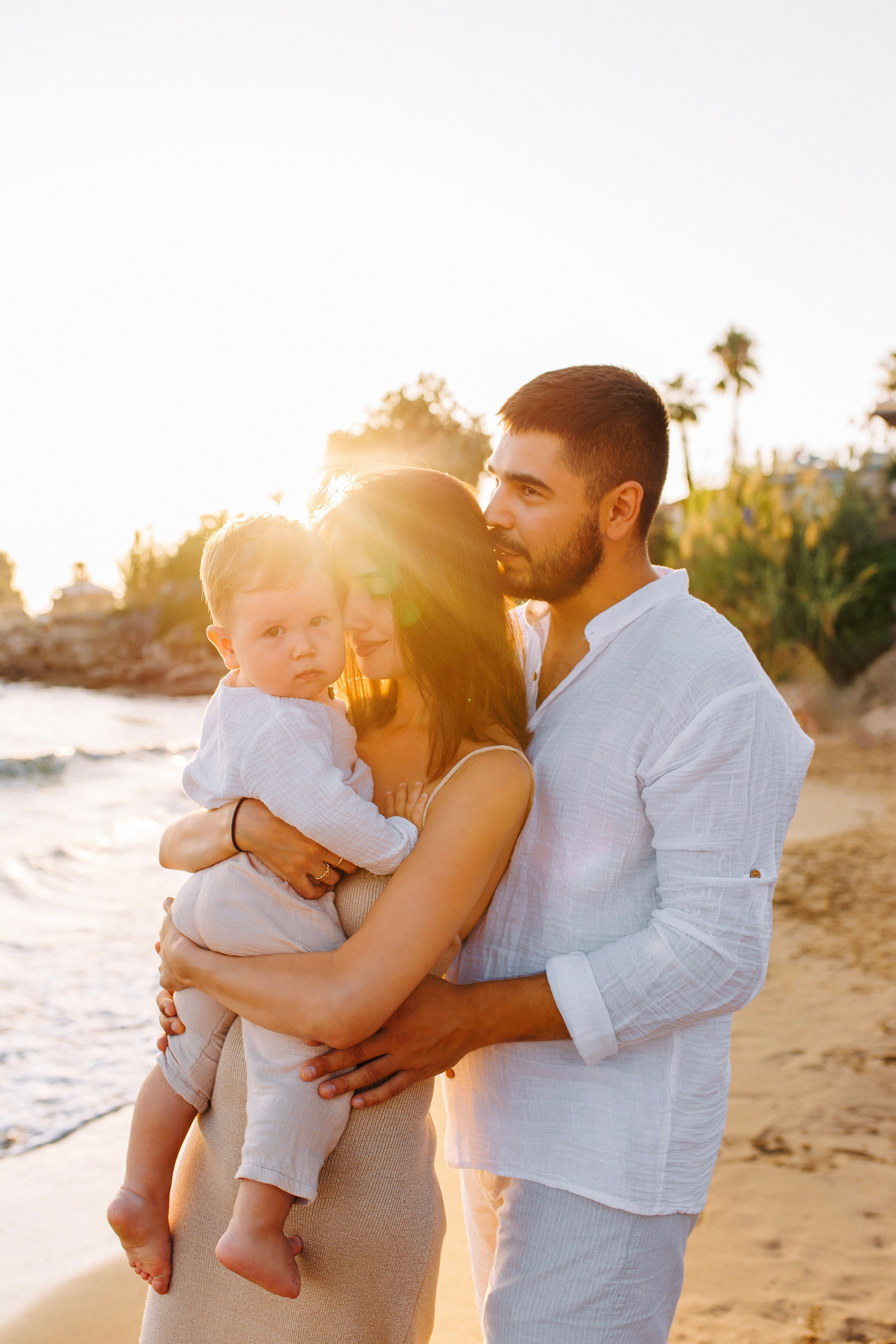 Family photo session at sunset on the beach