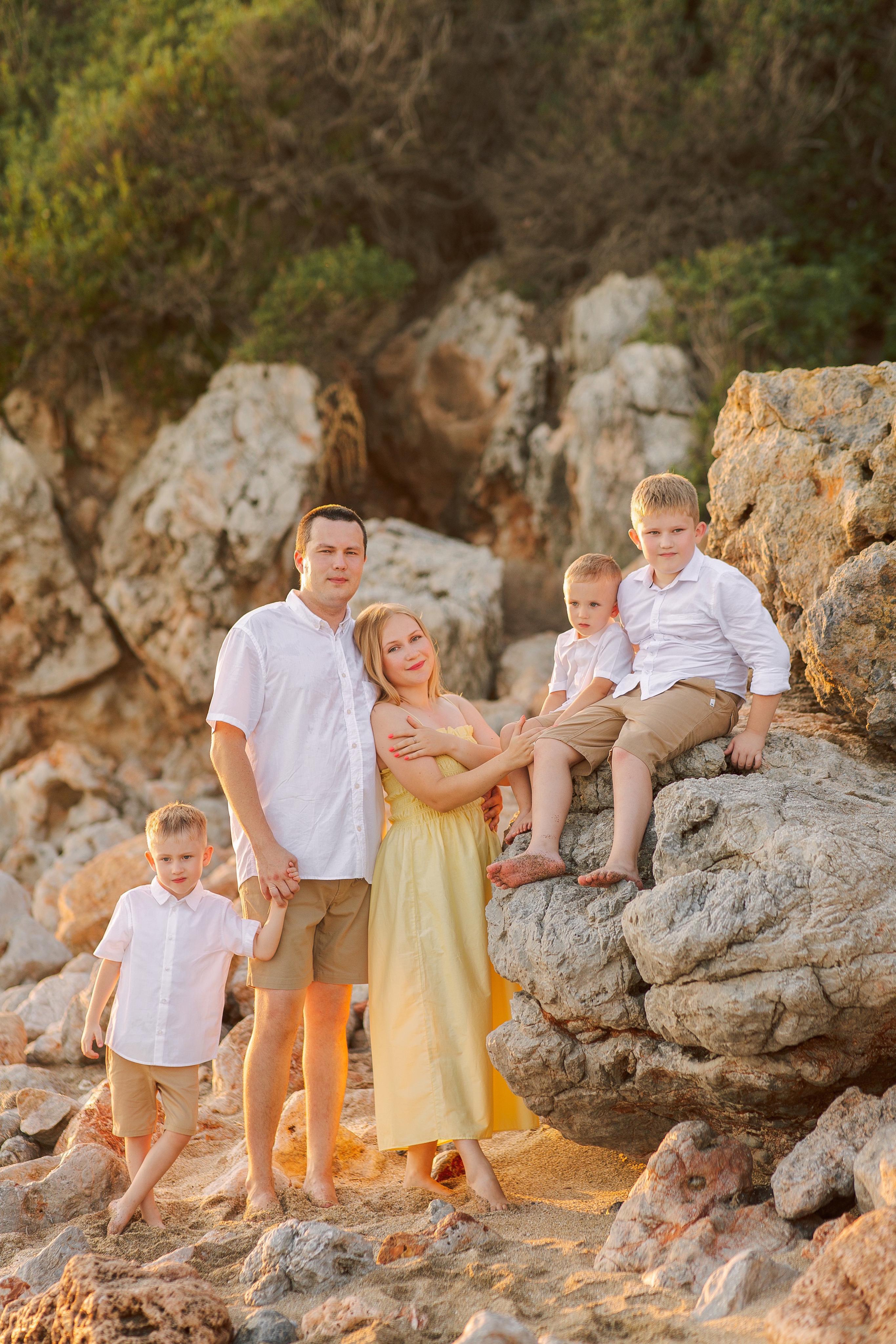Family photo session on Cleopatra Beach at sunset