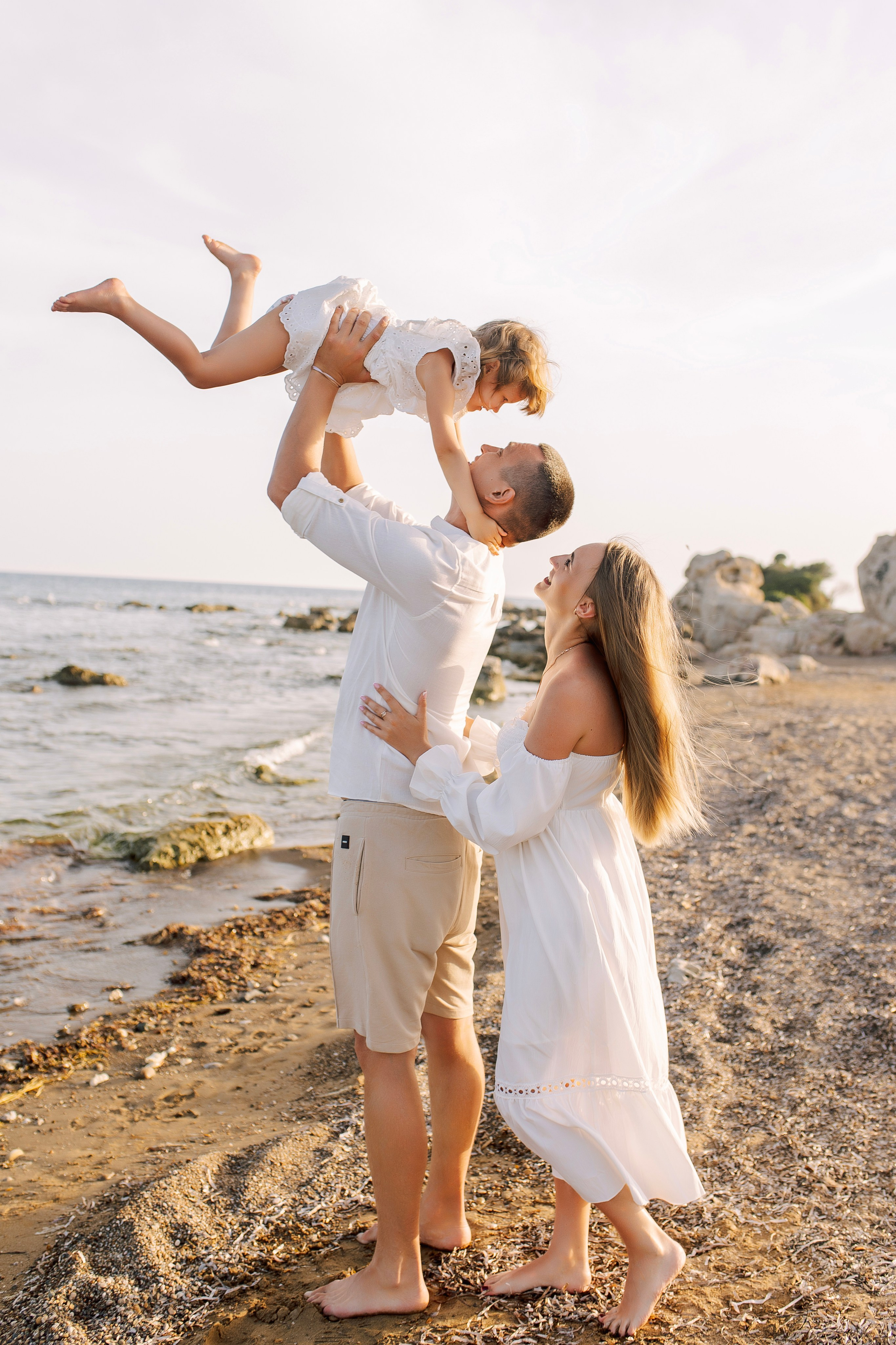 Beach. Sunset. Family photo session on the beach in Side at sunset.