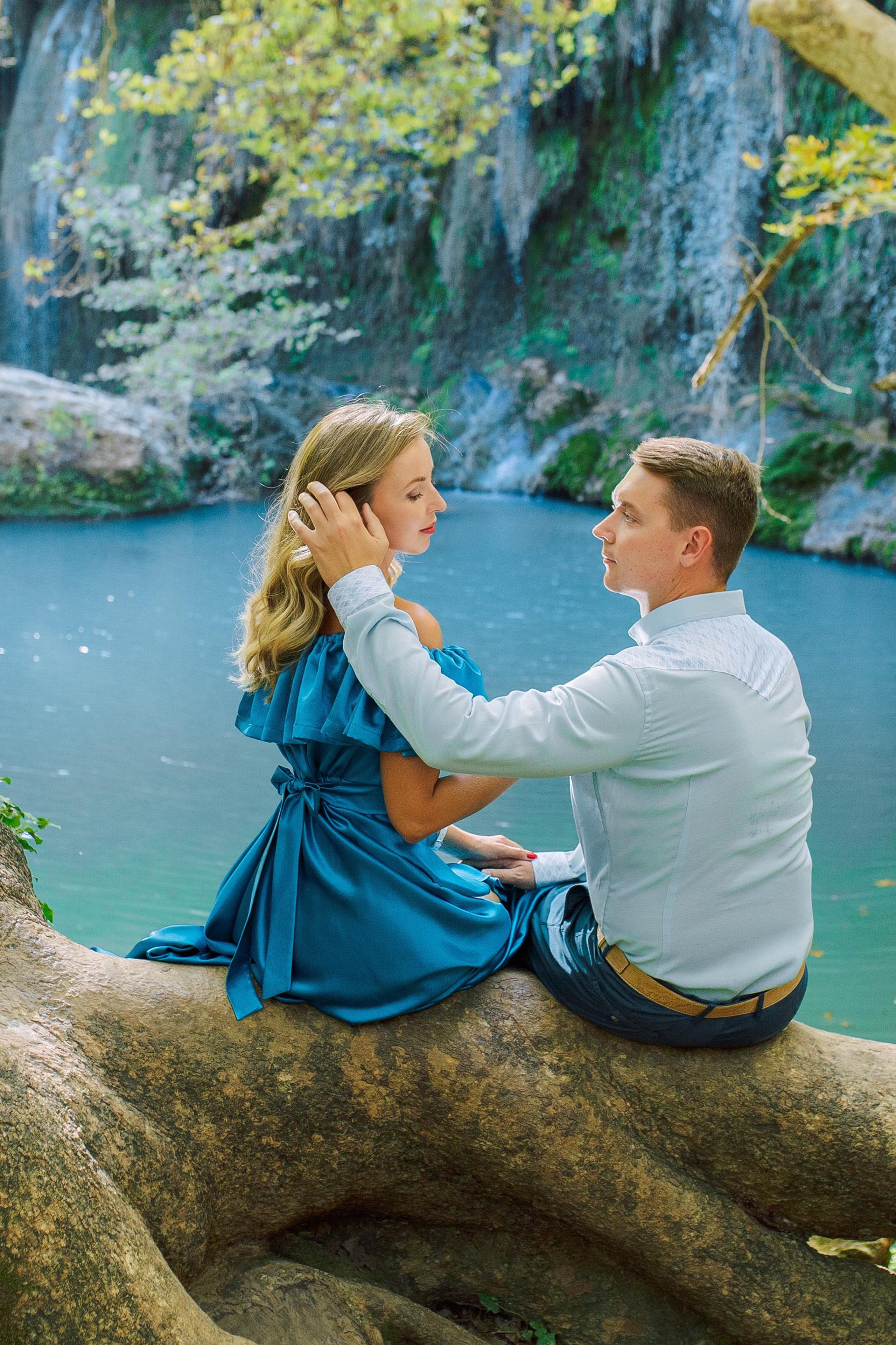 Day. Magic waterfall. Love story photo session of couples