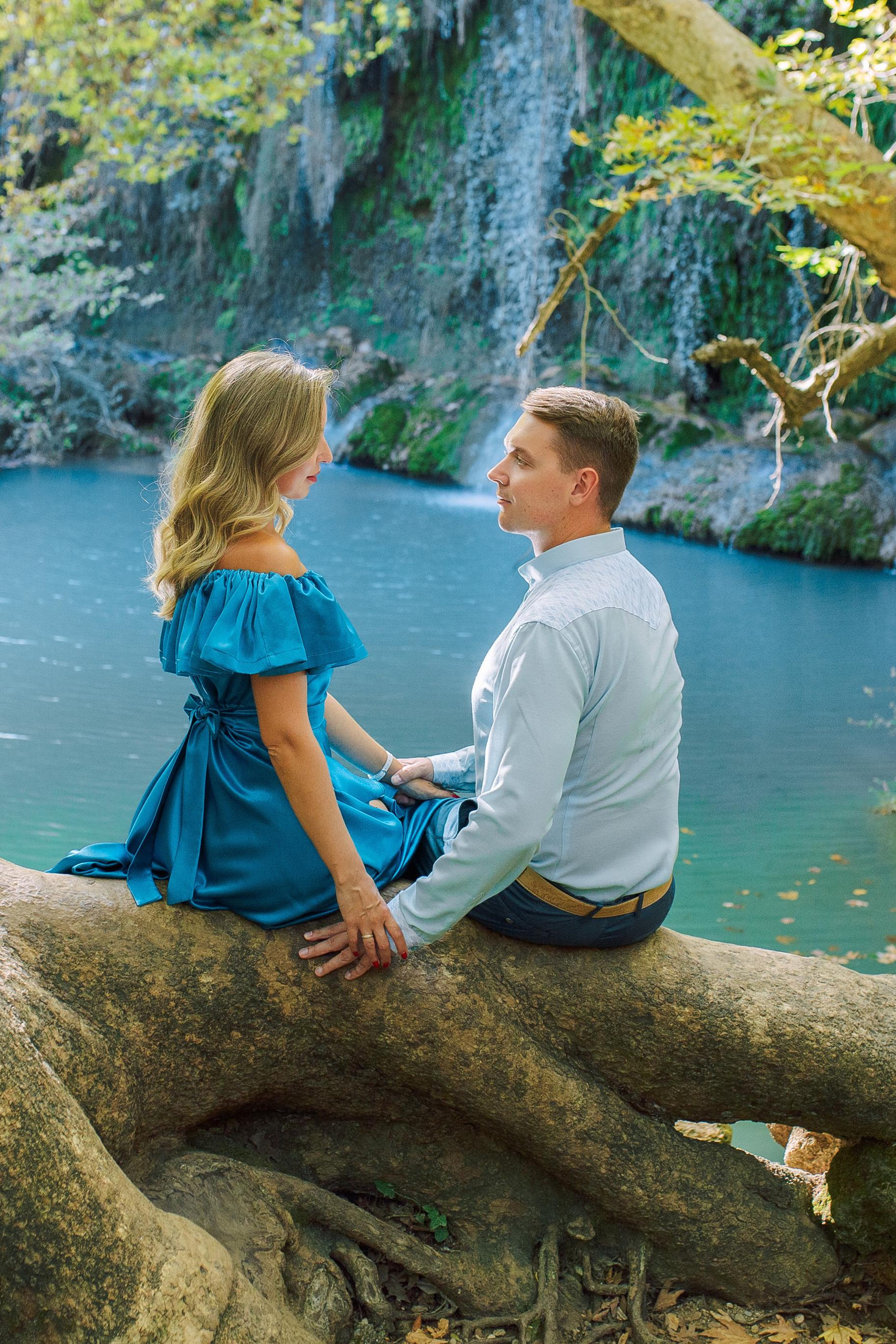 8. Magic waterfall. Love story a  couple near a waterfall