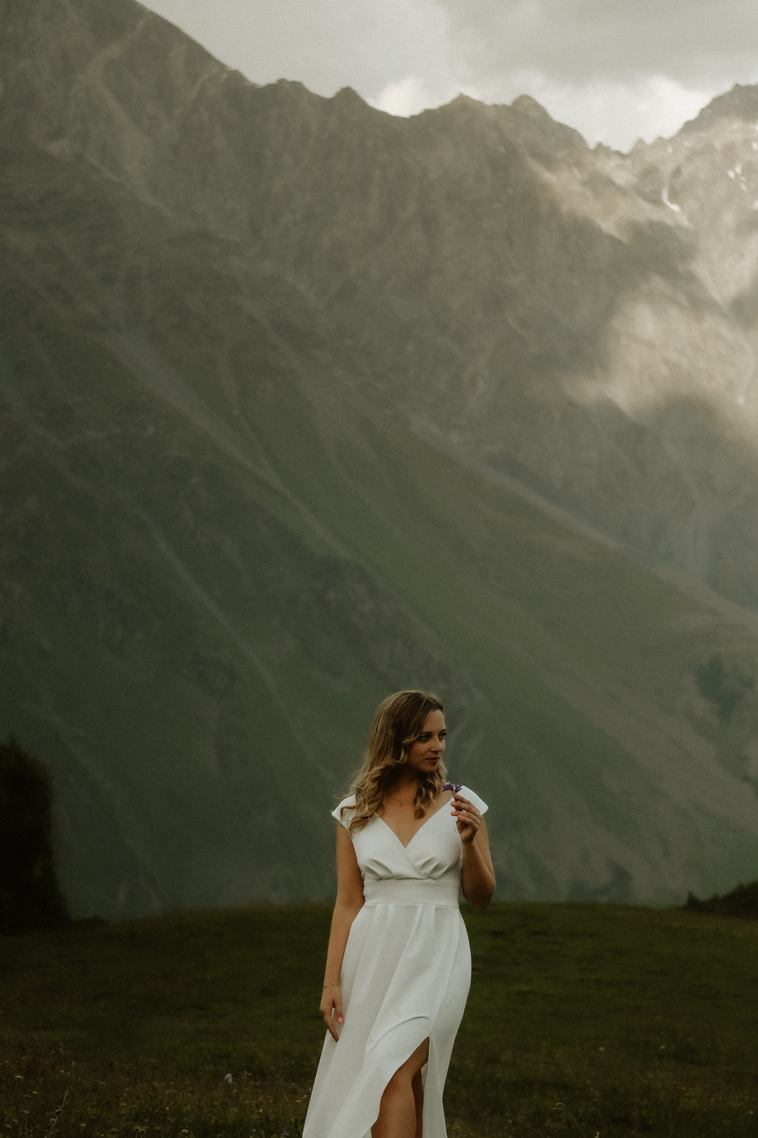 Golden hour portrait of a bride in the alpine fields of Kazbegi, Georgia