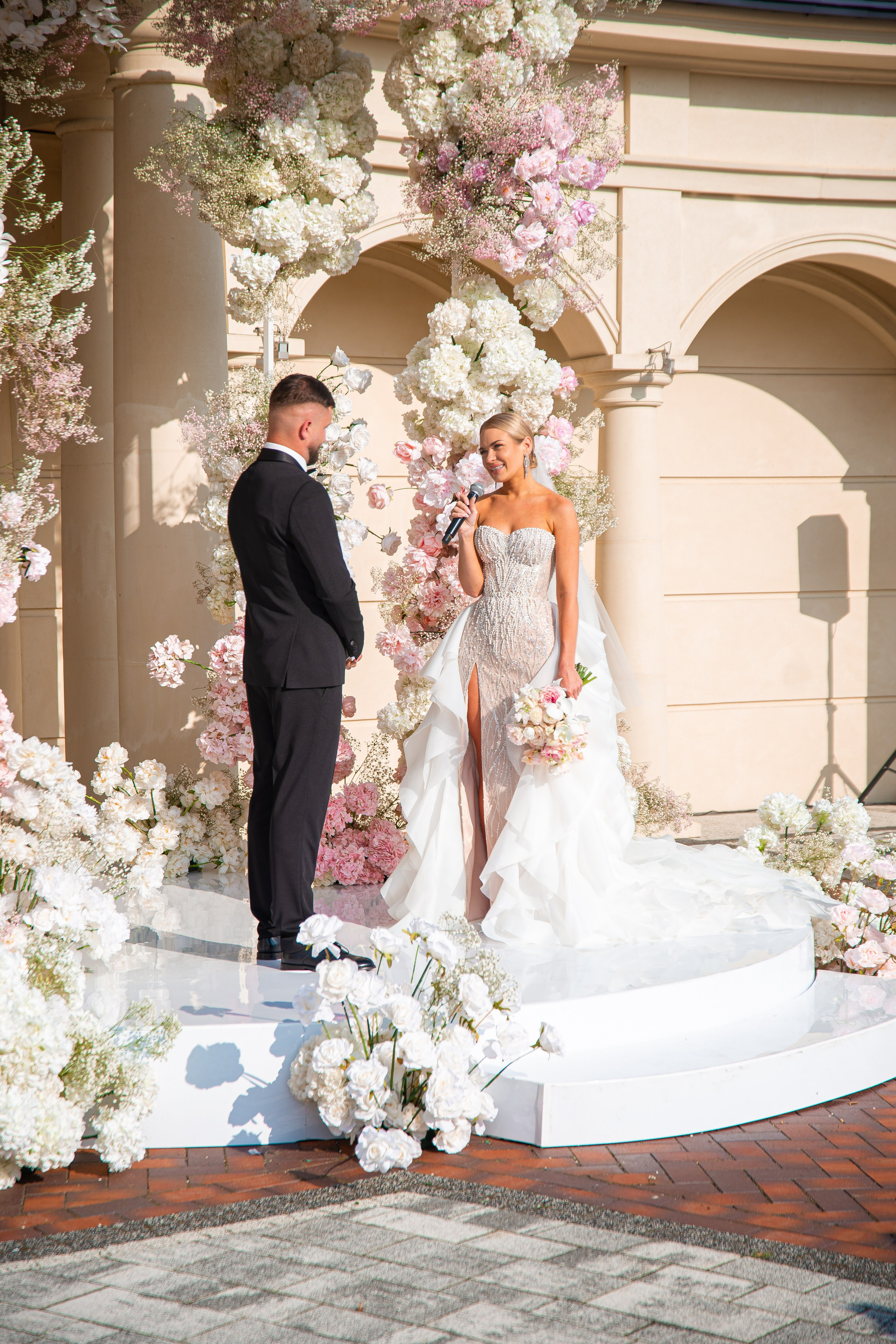 Wedding couple embracing with Mediterranean views