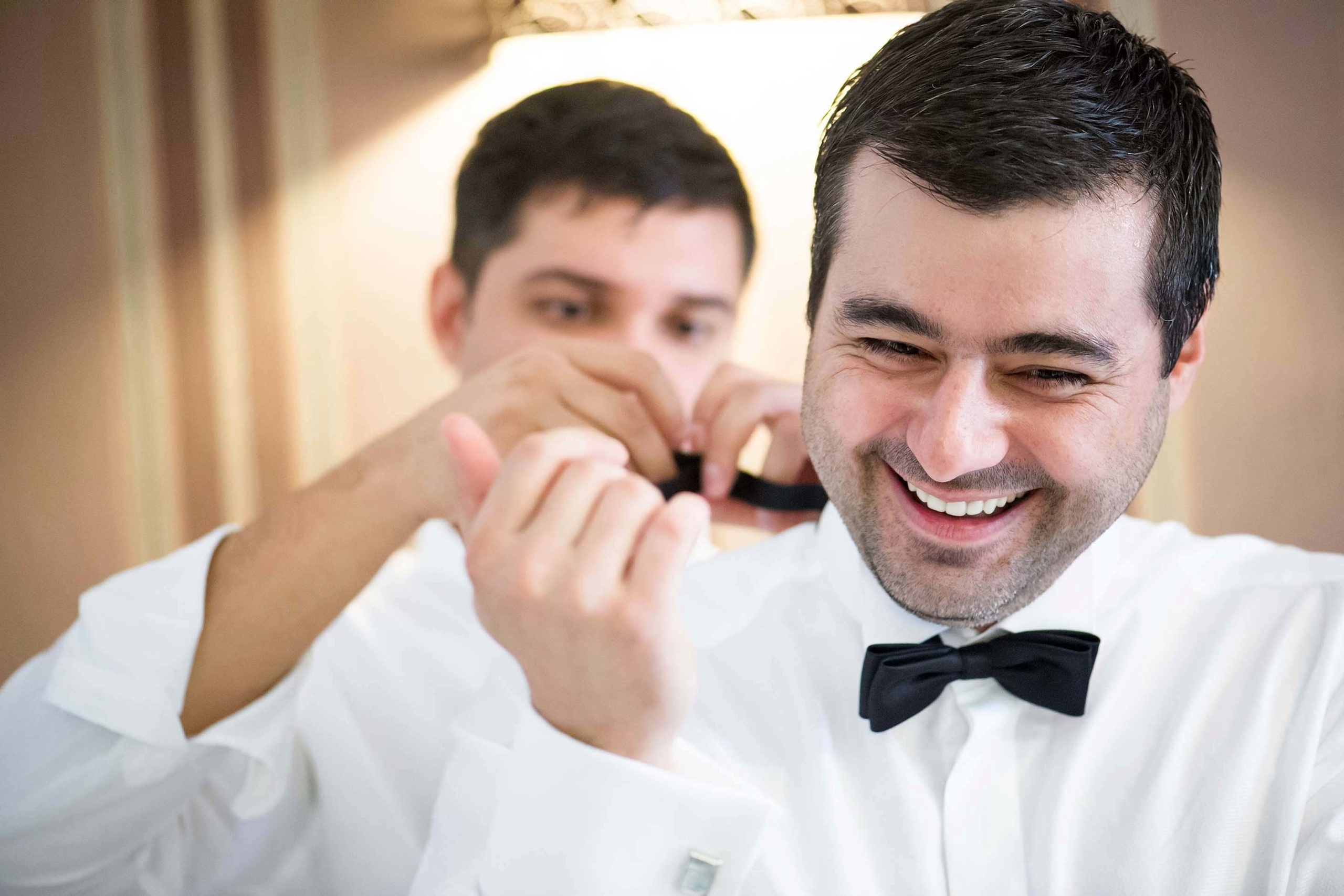 Wedding photographer Constanta Romania groom fixing cufflinks  Nikon D850