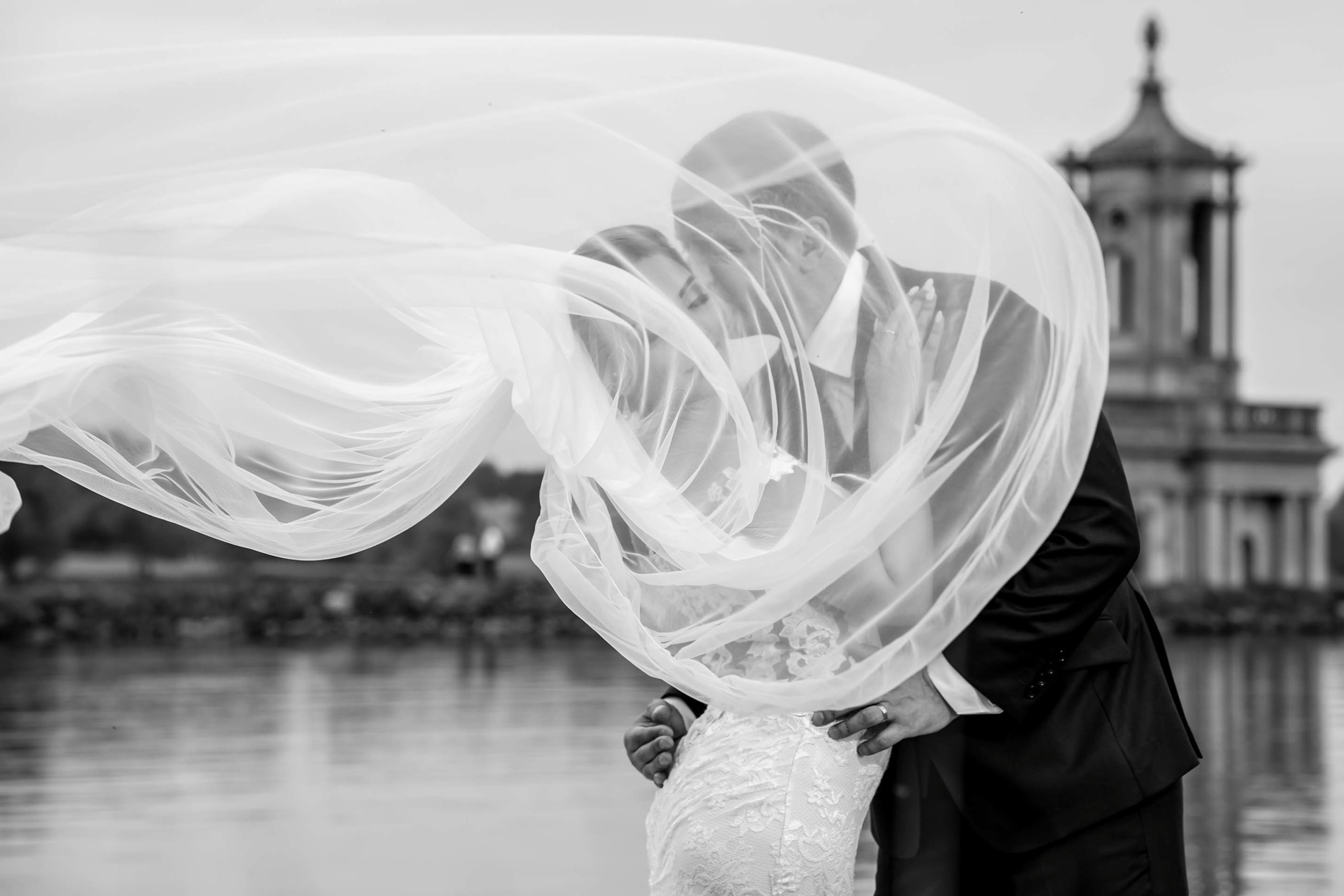 Wedding photography session Normanton Church Rutland Water Oakham UK. Wedding photographer Nikon D850 couple kissing