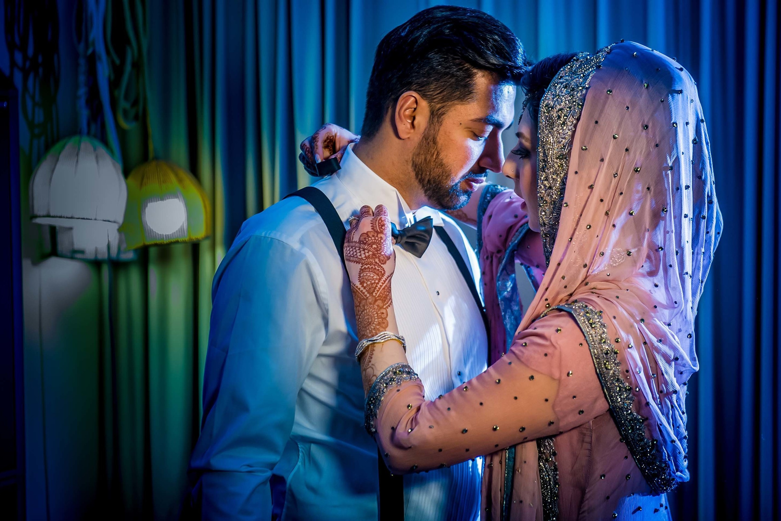 Weddings photo session with bride fixing groom's bow tie. Scandic Fornebu Oslo Norway.Wedding photographer D850 