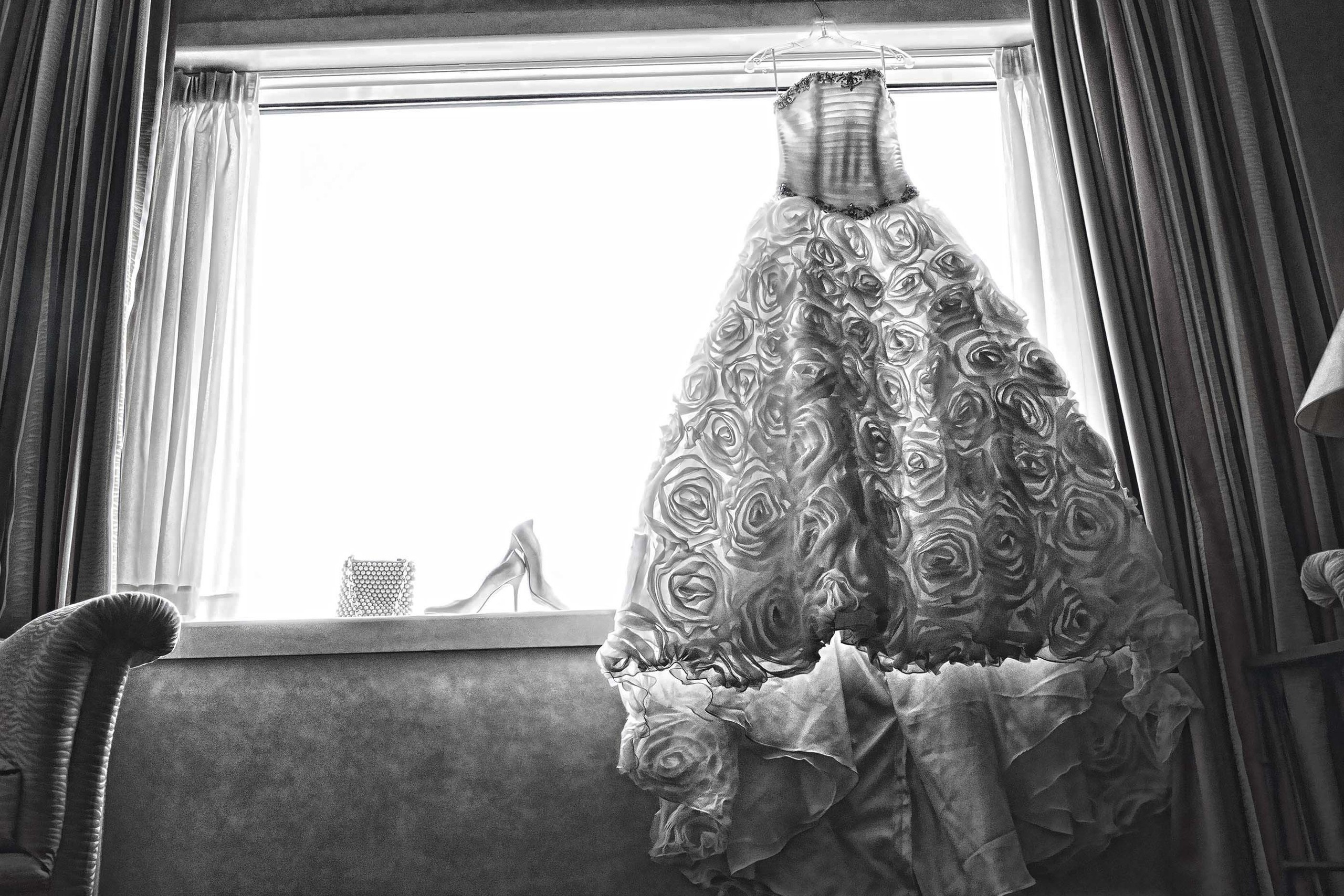 Wedding photographer Intercontinental Hotel Bucharest Romania bridal dress bridal shoes at the window Nikon D850