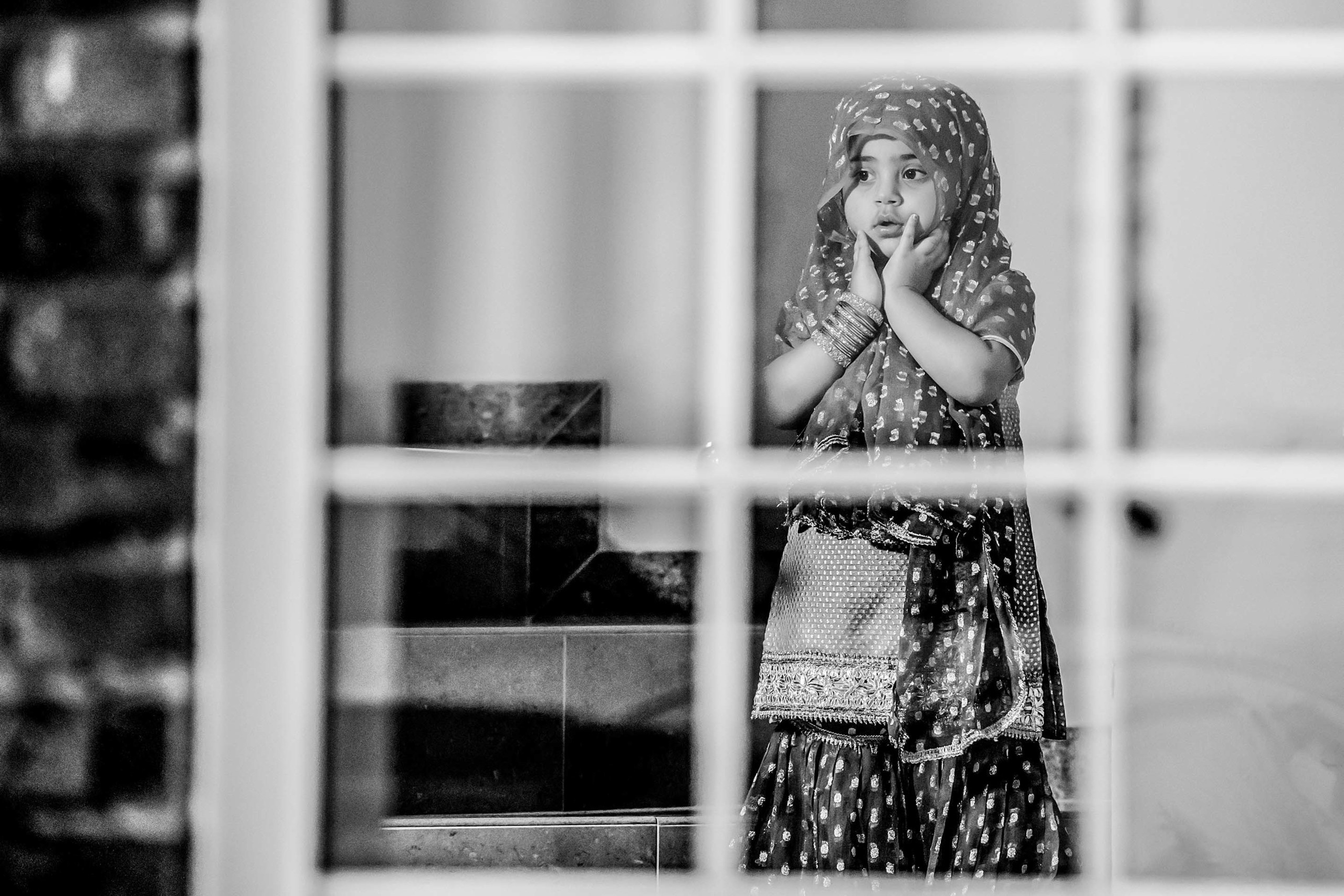 Wedding photographer Higginson Park, Marlow UK small girl  looking outside of window Nikon D850