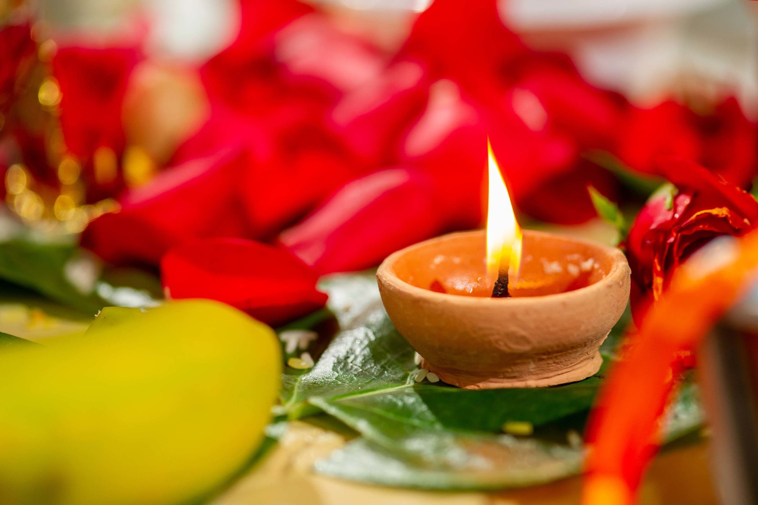 Wedding photographer Southall , London UK Nikon D850 flowers and candle religious Hindu ceremony