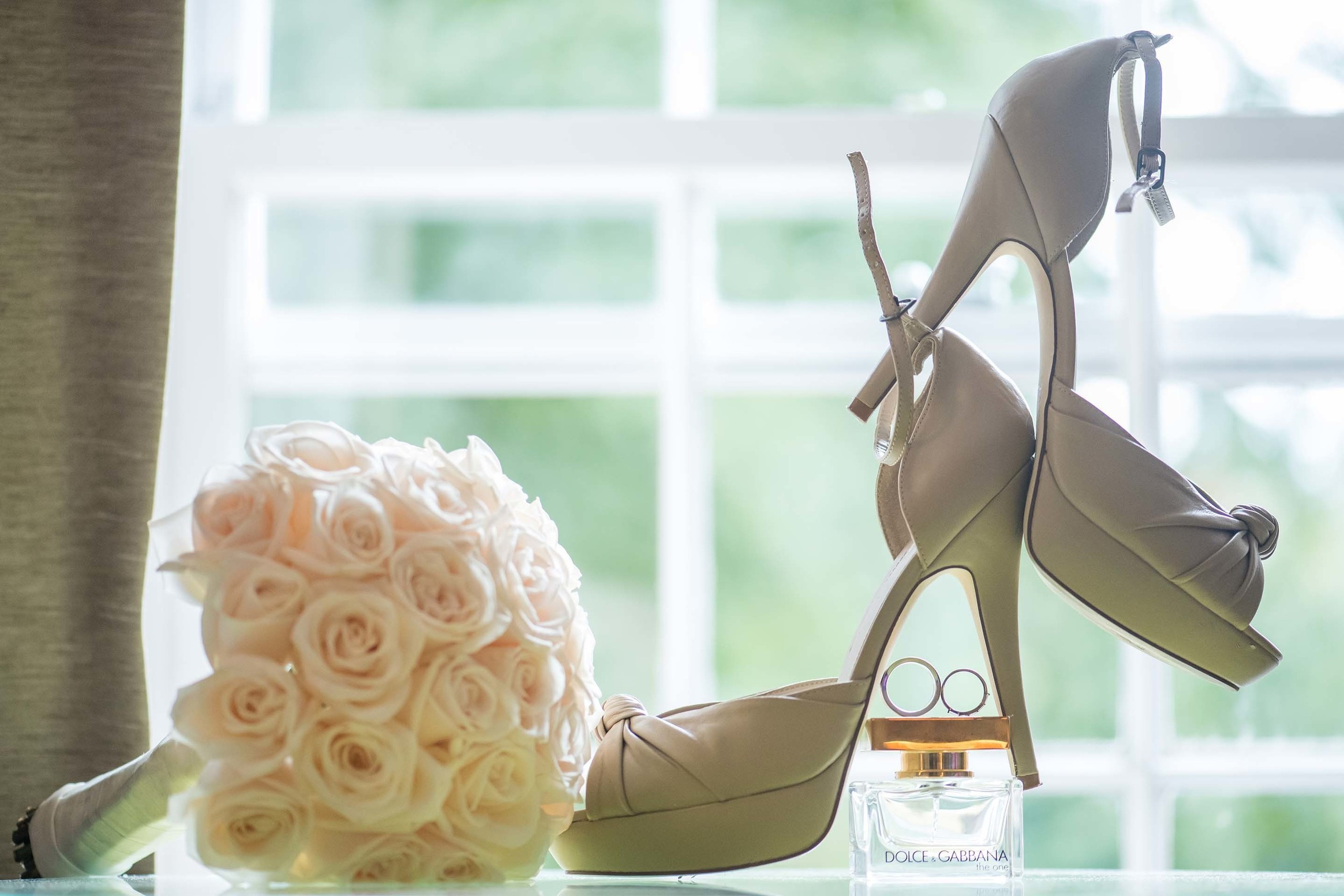Wedding photographer Canary Riverside Plaza Hotel, wedding shoes and flower bouquet London UK Nikon D850