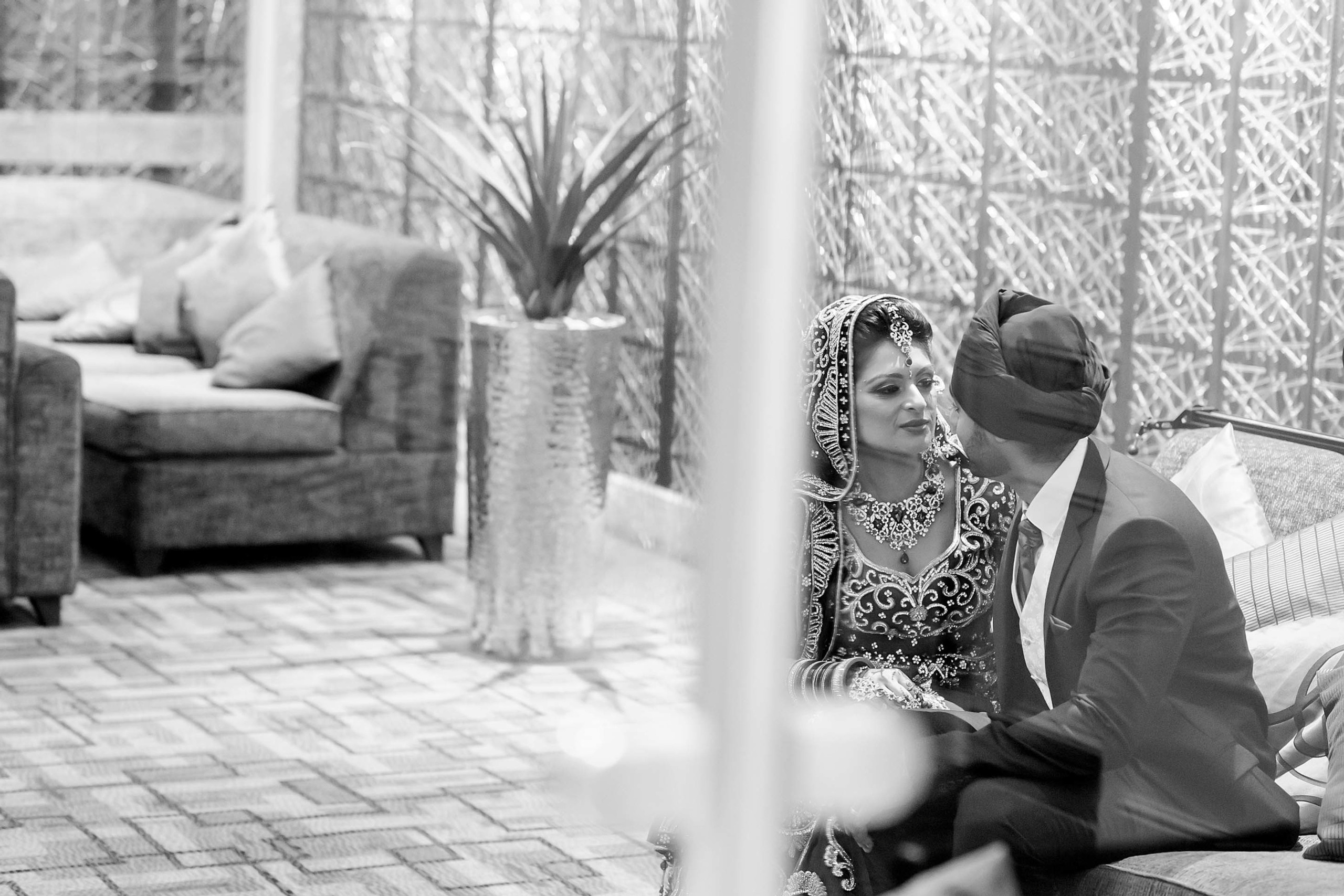 Wedding photography session Thistle London Heathrow T5 London UK. Wedding photographer Nikon D850 couple talking in the lobby