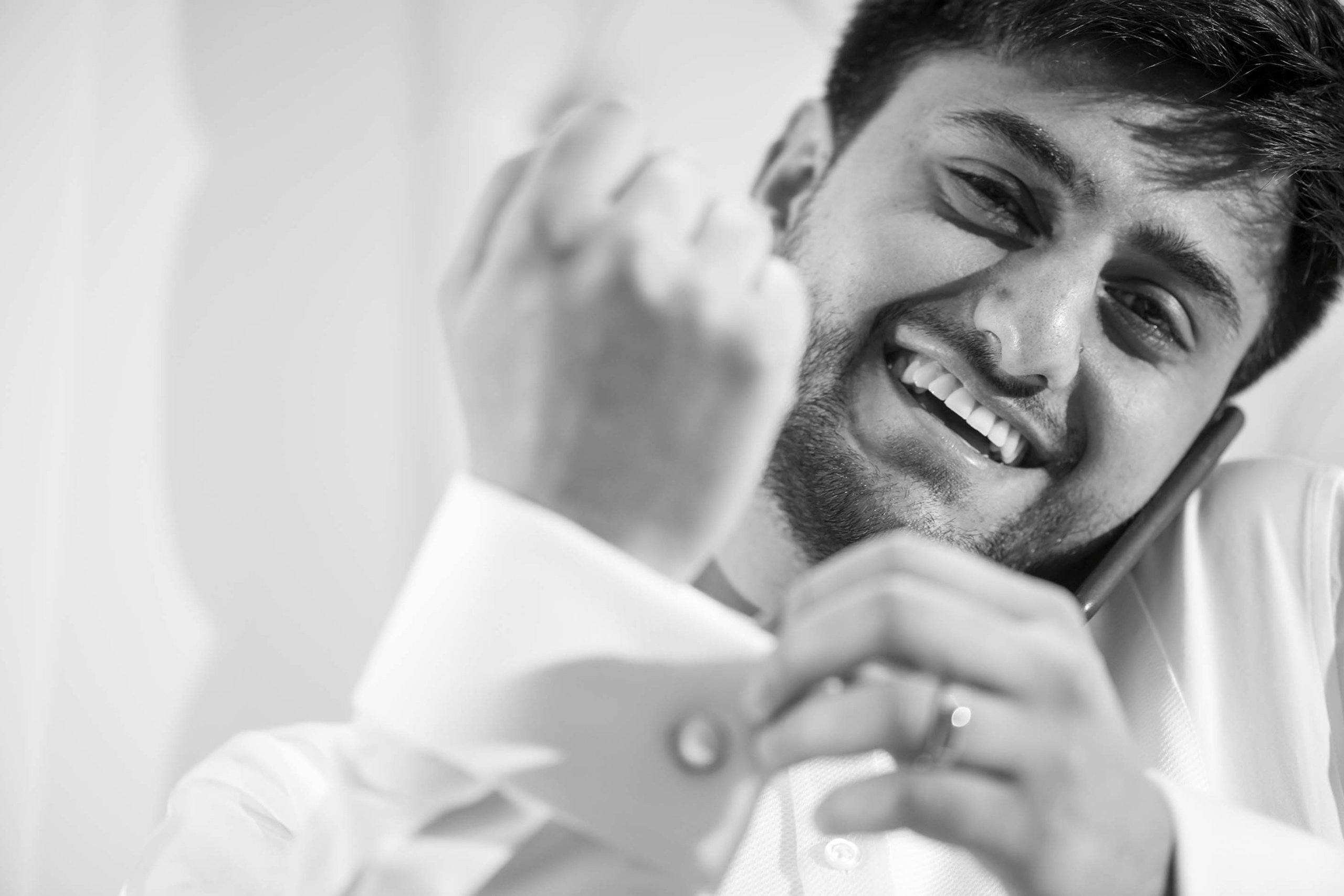 Wedding photographer Meridian Grand, London UK groom fixing cufflinks Nikon D850