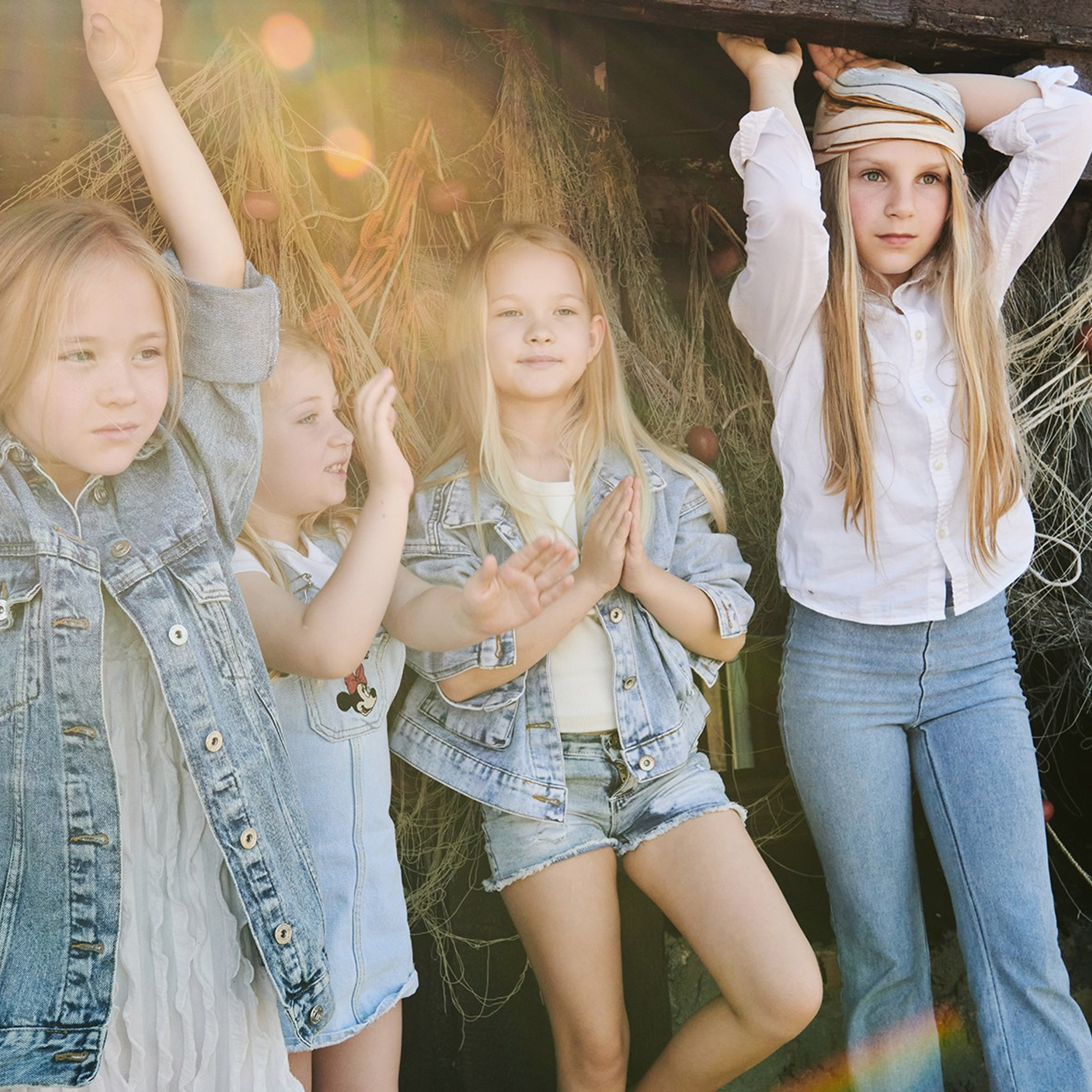 Editorial kids fashion photography featuring a group of child in trendy clothing, styled for seasonal collection showcasing careless childhood