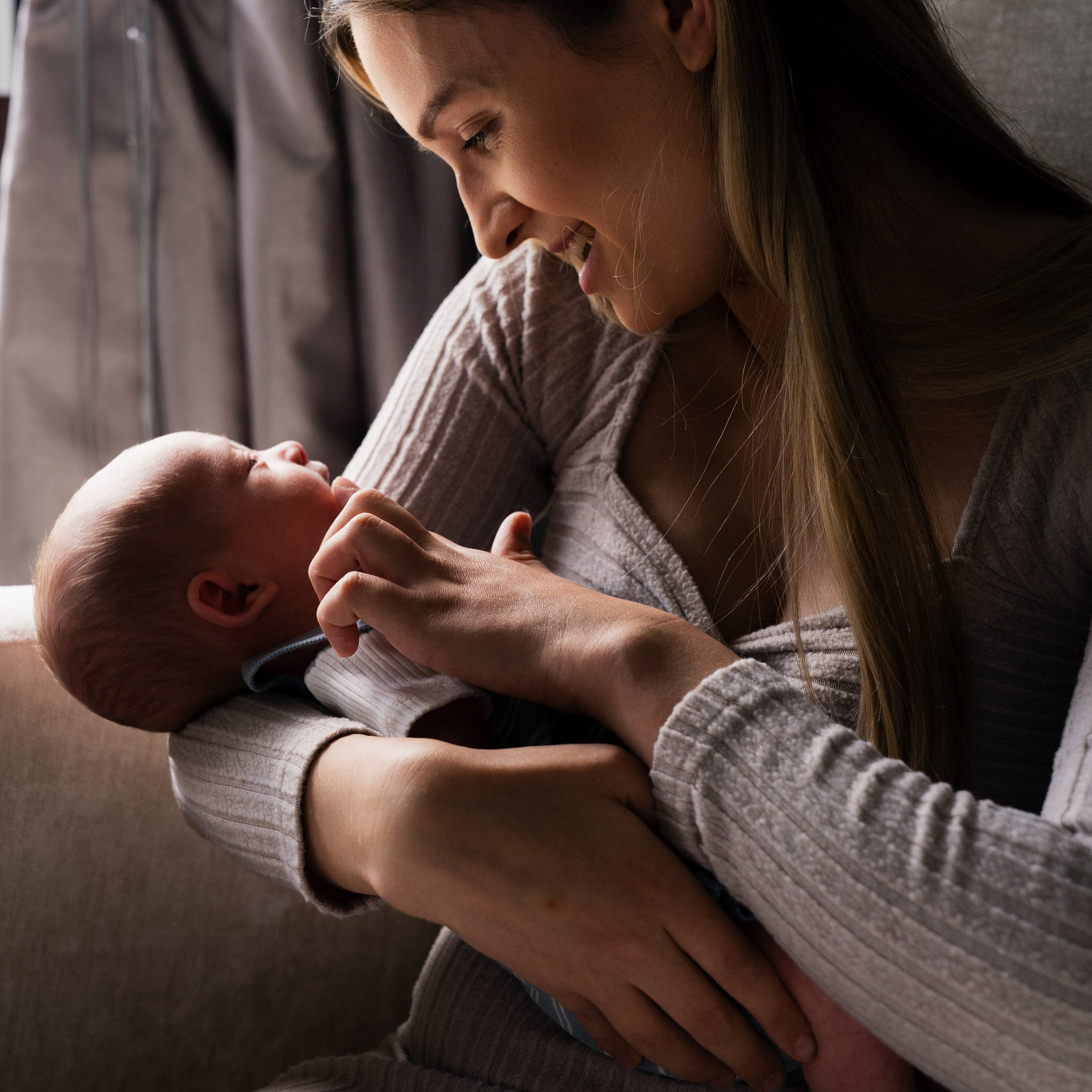 Newborn photographer Alnwick photographing a sleeping newborn baby during a relaxed family newborn session at home.