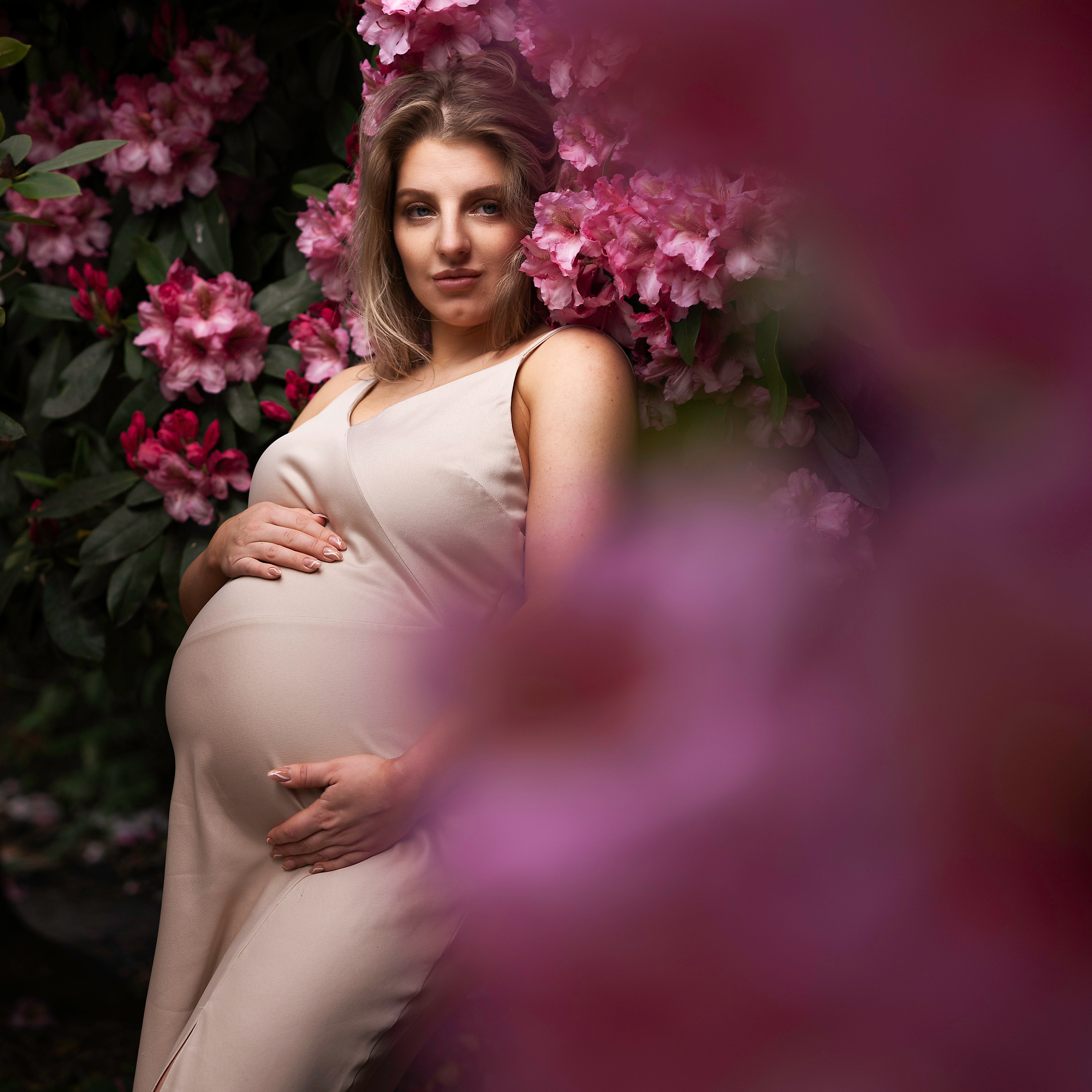 "A stunning model captured amidst the vibrant Rhododendrons of Leeds, showcasing the beauty of nature."