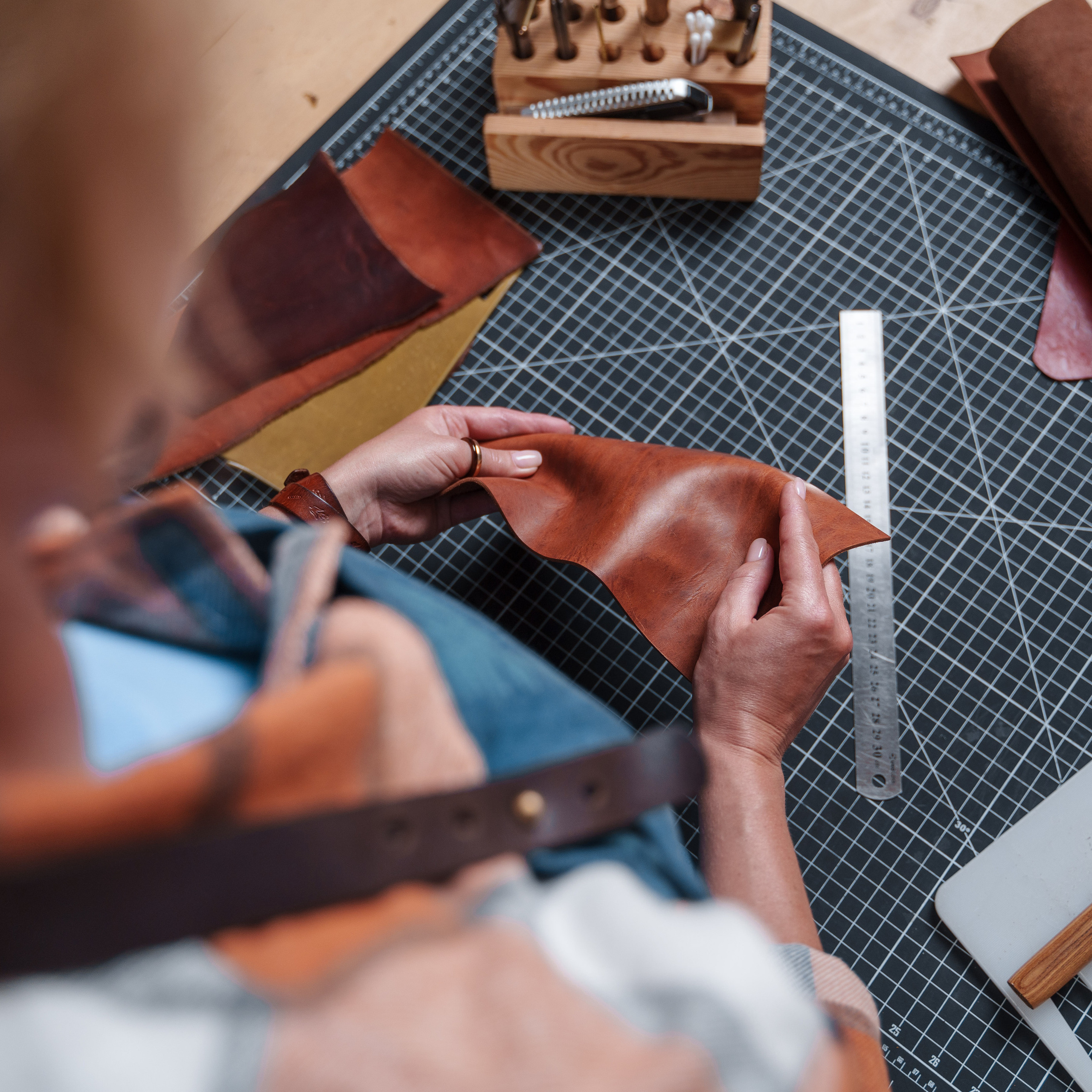 Photos of the craftsman in the leather workshop. Dmitrii Shmatov — High-End Portrait & Fashion Photographer in Milan