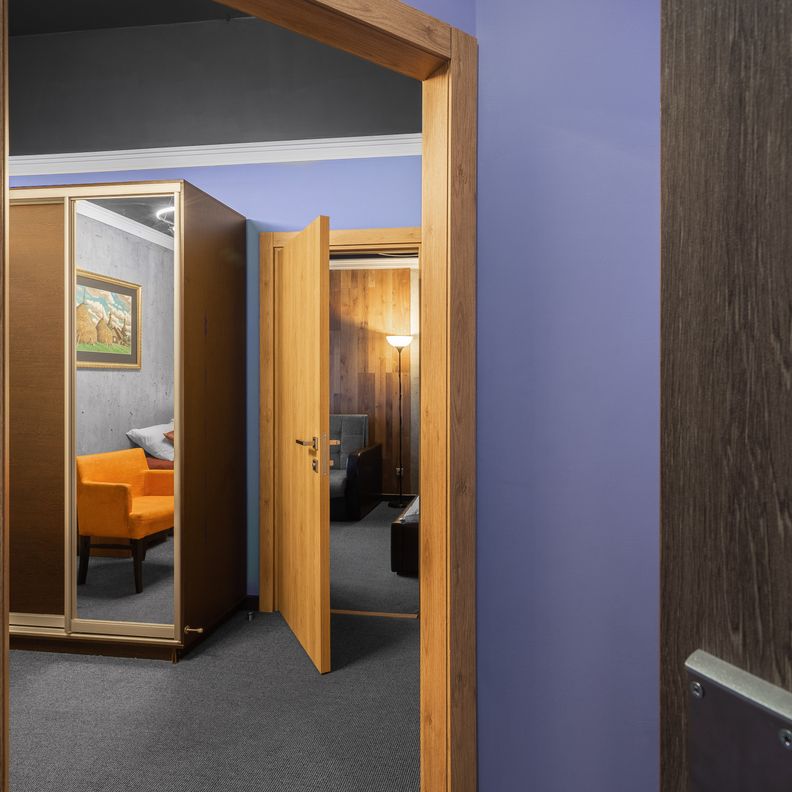 Open doorway revealing a cozy interior space with contrasting warm and cool tones, likely photographed with a standard lens to capture the inviting depth of the room