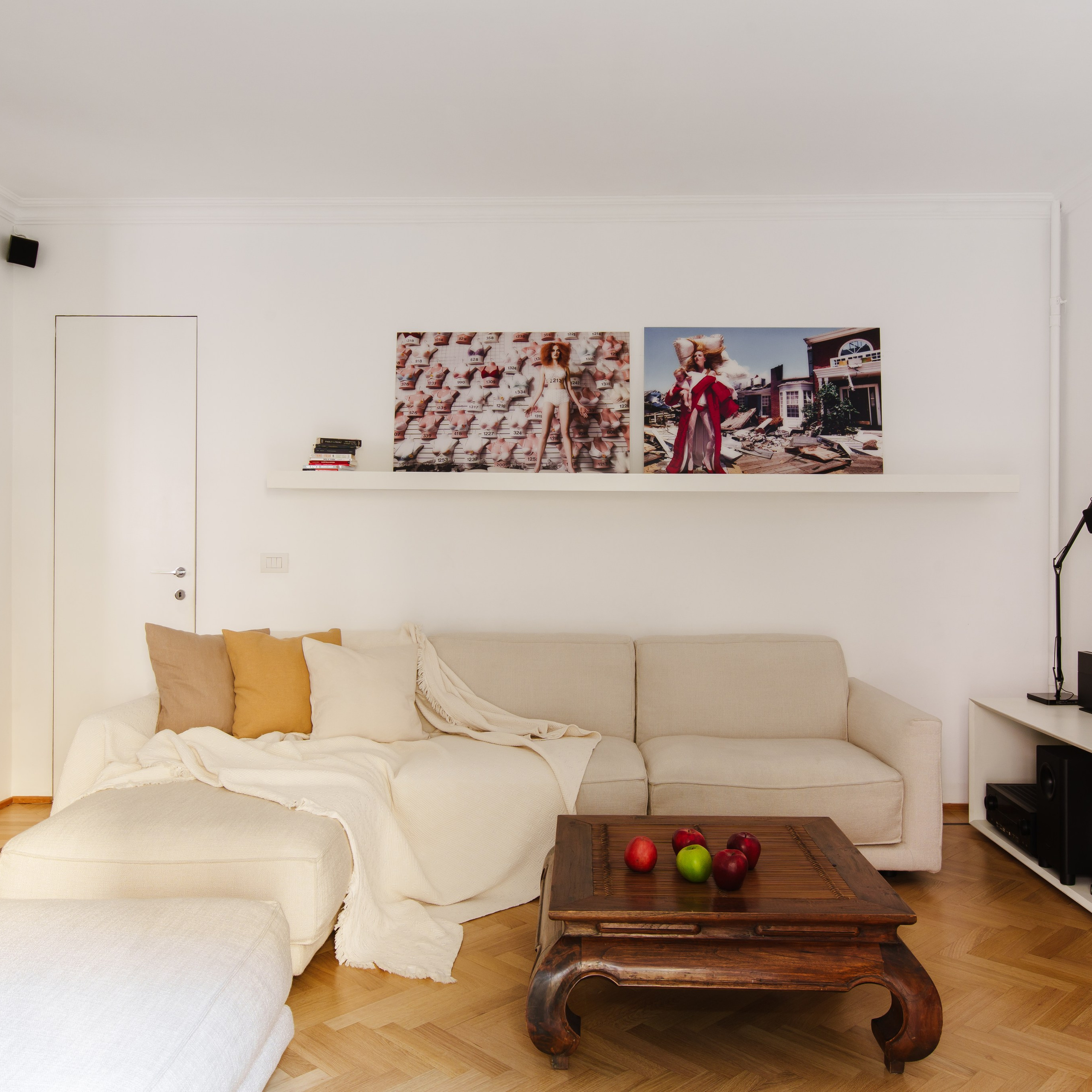 Spacious living room captured in natural daylight with a homely aesthetic; photographed with a wide-angle lens to accentuate the room’s dimensions and ambient lighting conditions