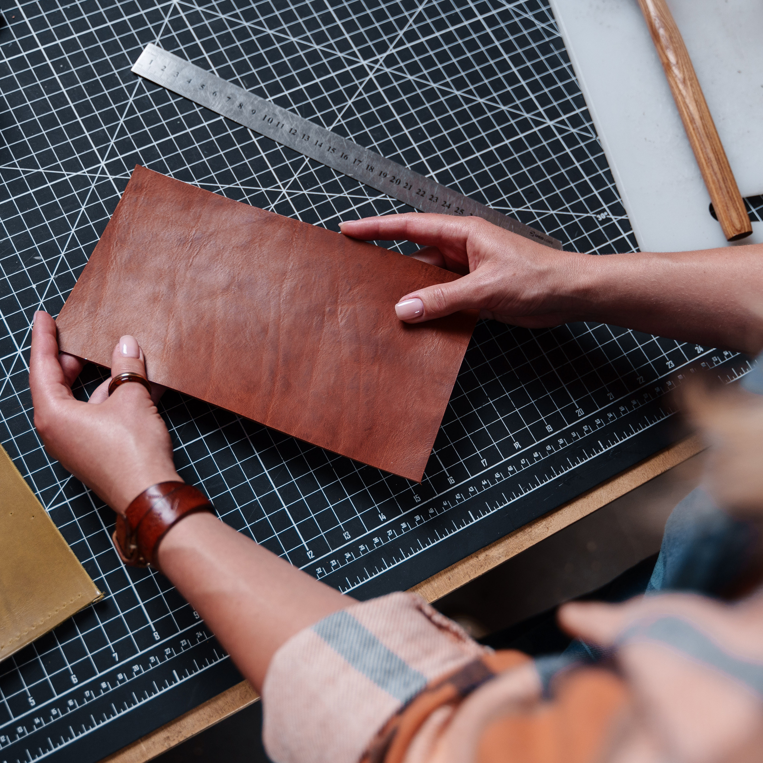 Photos of the craftsman in the leather workshop. Dmitrii Shmatov — High-End Portrait & Fashion Photographer in Milan