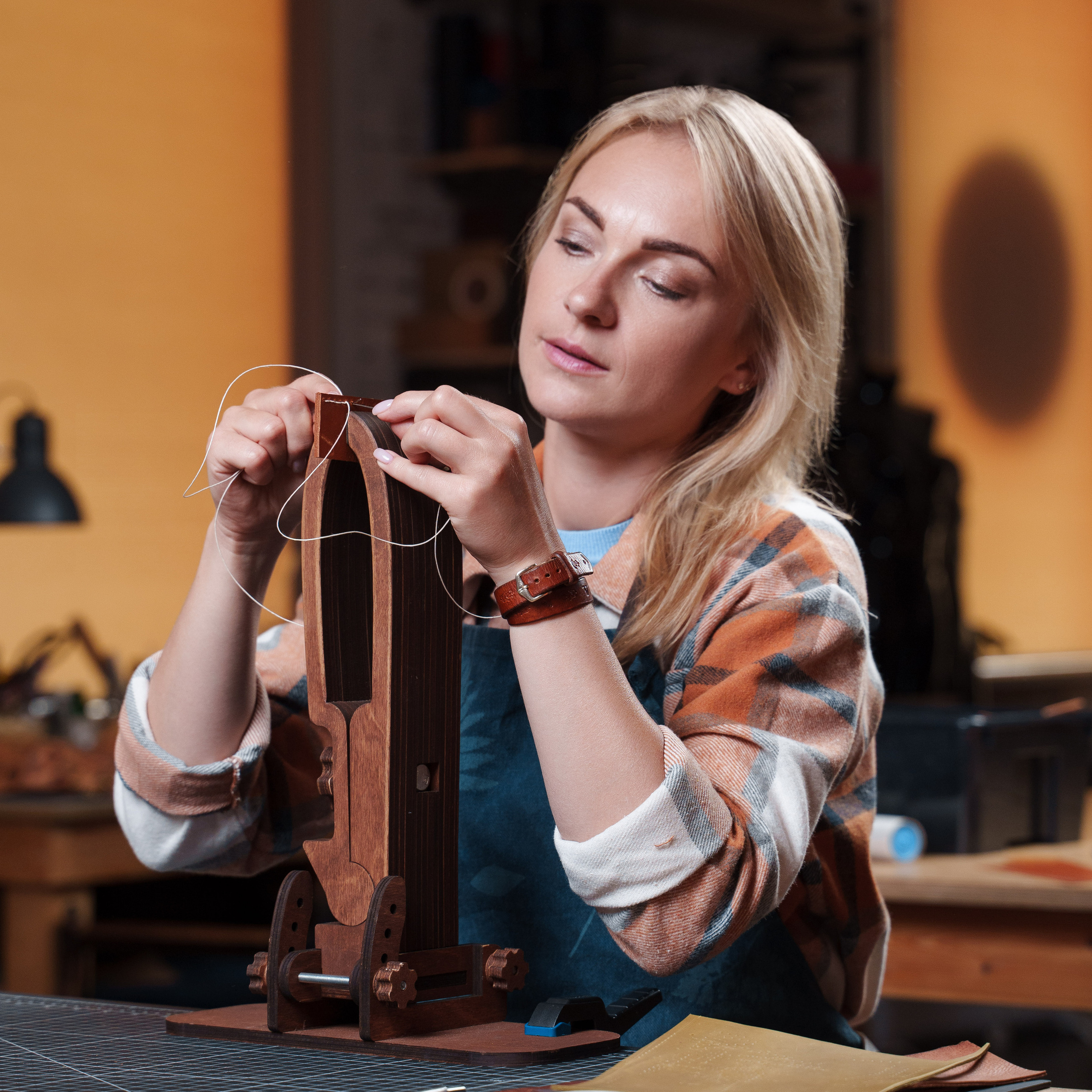 Photos of the craftsman in the leather workshop. Dmitrii Shmatov — High-End Portrait & Fashion Photographer in Milan
