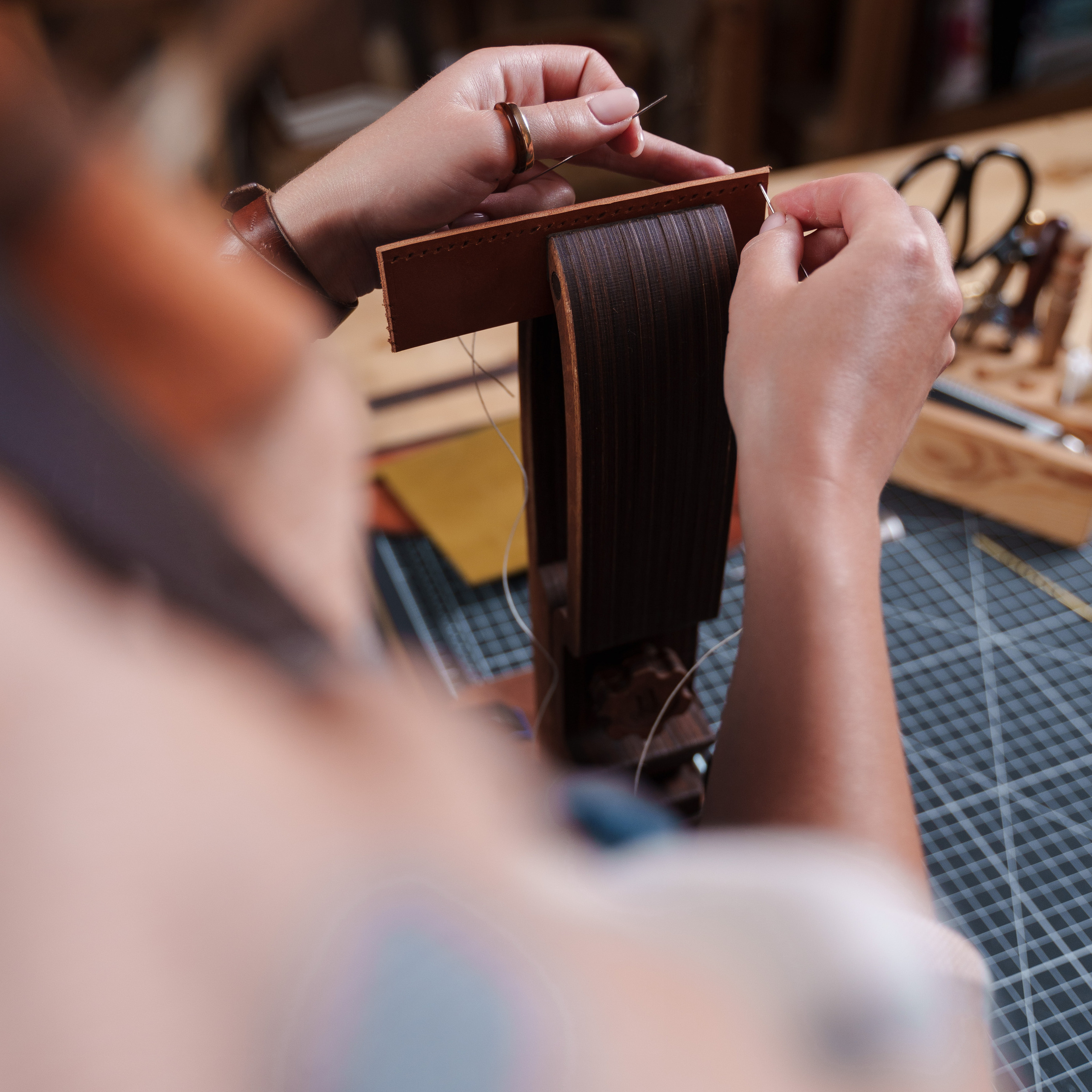 Photos of the craftsman in the leather workshop. Dmitrii Shmatov — High-End Portrait & Fashion Photographer in Milan
