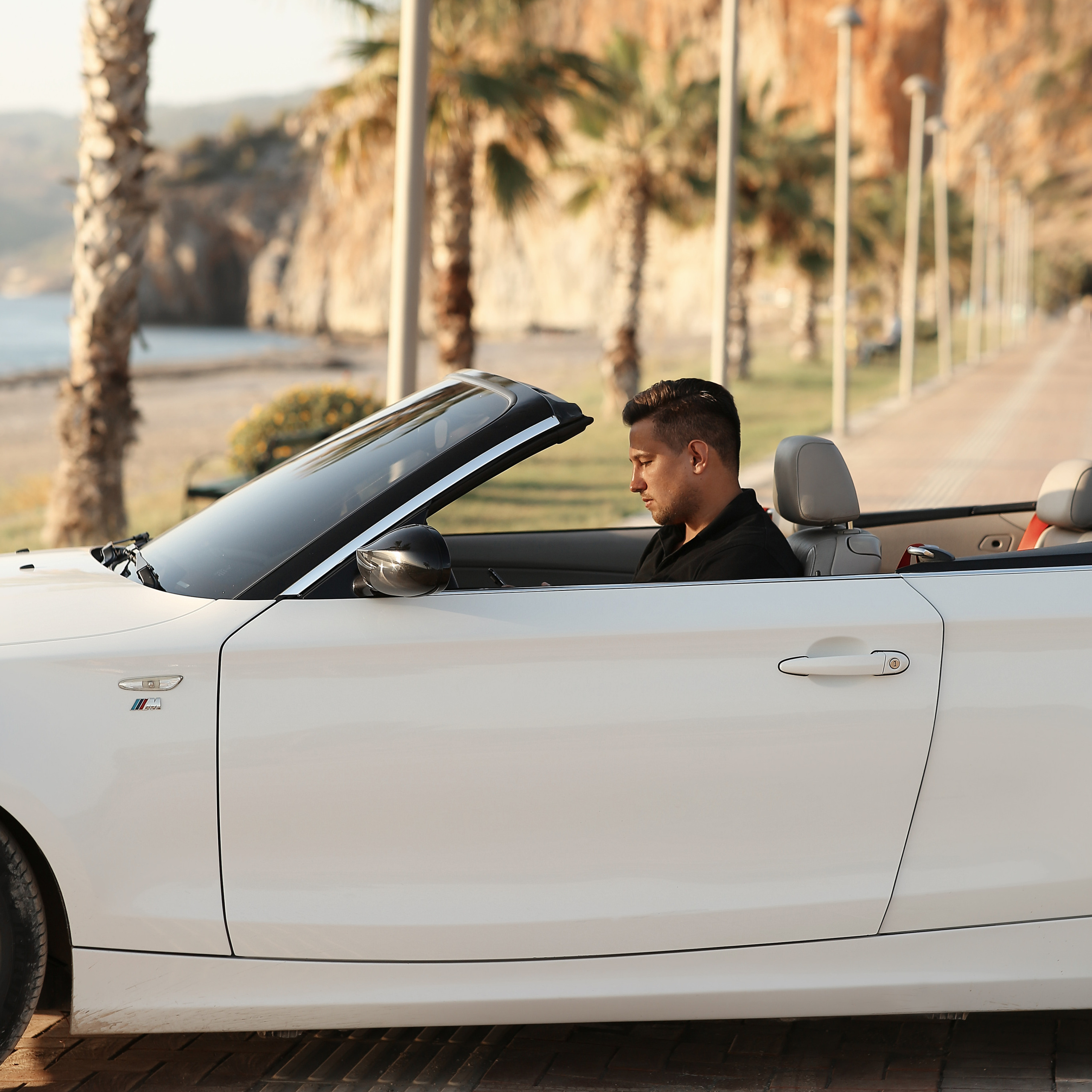 Filming for content with a cabriolet. Alsu Develi, Photographer in Turkey, Alanya, Side, Belek, Antalya, Kemer, Turkiye. Photoshooting in Alanya. Photosession in Belek, Side