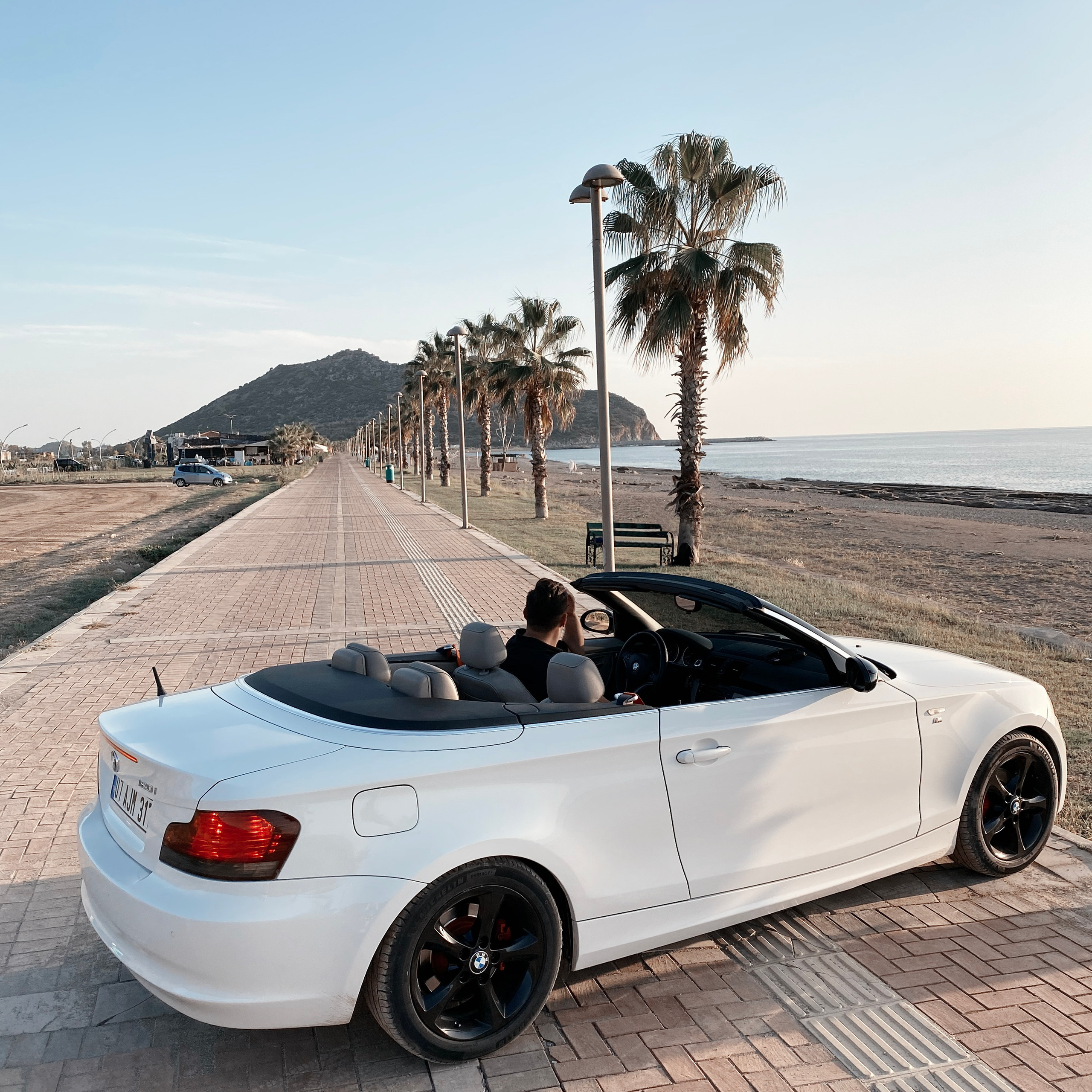 Filming for content with a cabriolet. Alsu Develi, Photographer in Turkey, Alanya, Side, Belek, Antalya, Kemer, Turkiye. Photoshooting in Alanya. Photosession in Belek, Side