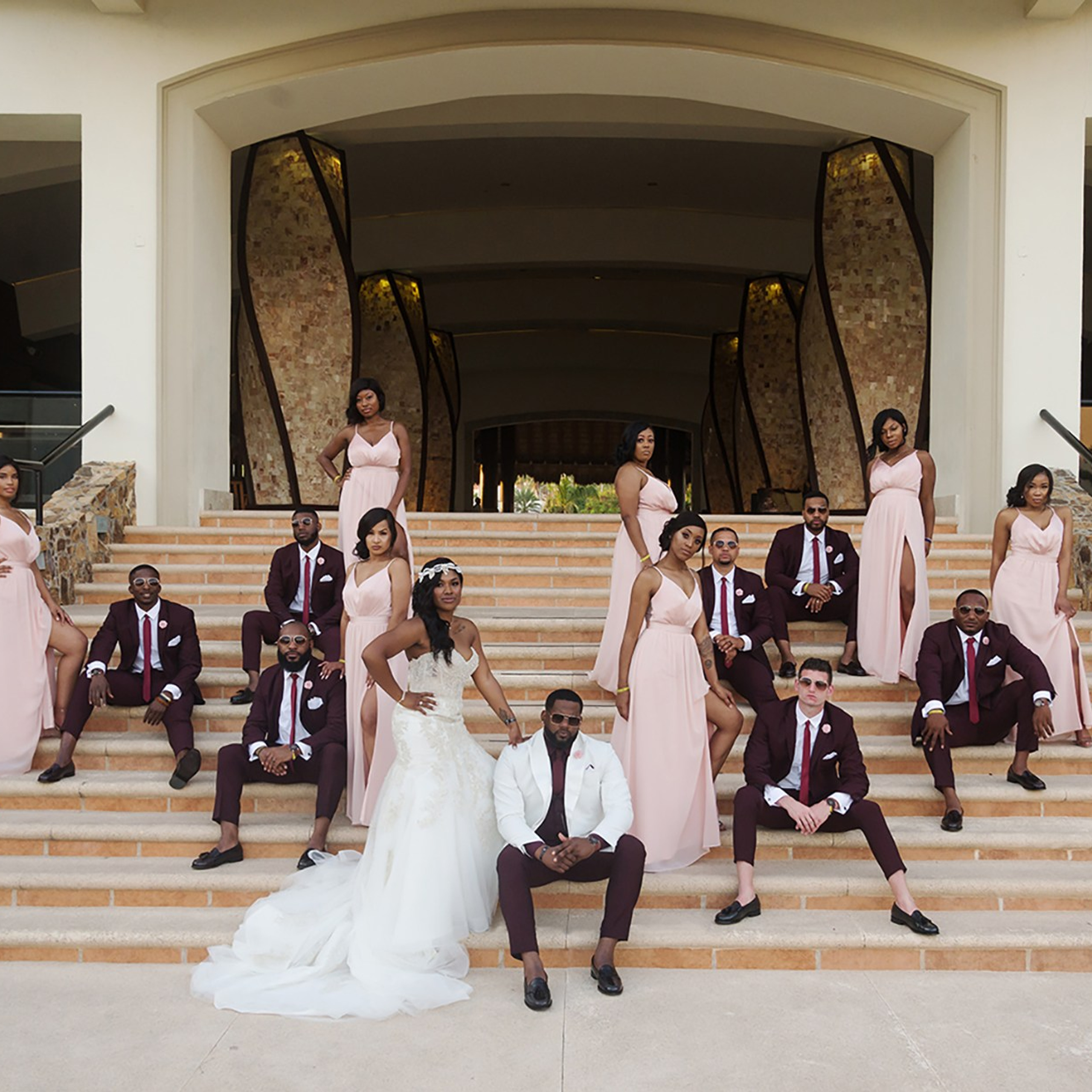 Los Cabos destination wedding photographer capturing bride and groom with bridal party, bridesmaids and groomsmen posing together at a beach wedding  (hyatt ziva)