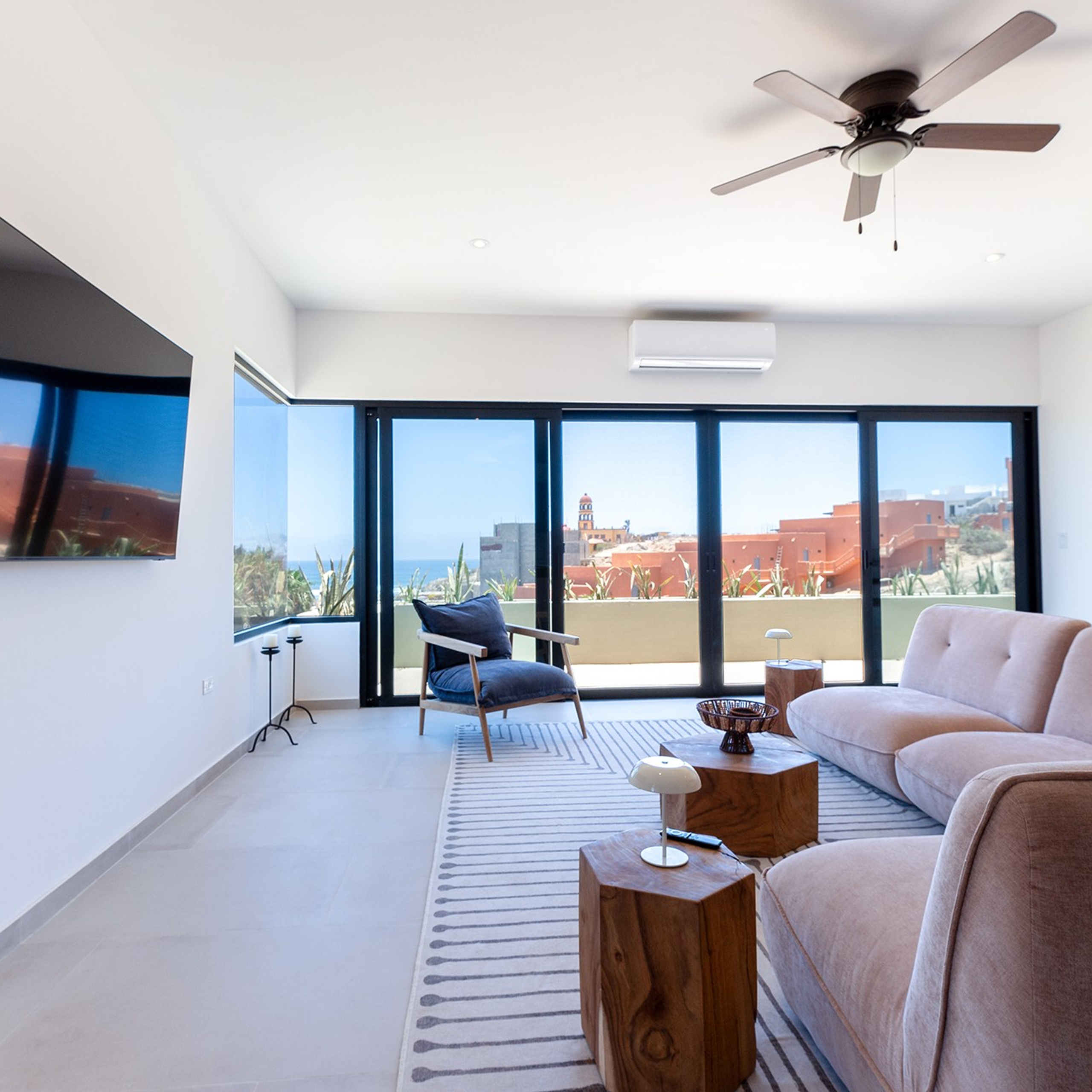 Bright living room with large windows in Pescadero vacation home: professional interior photography