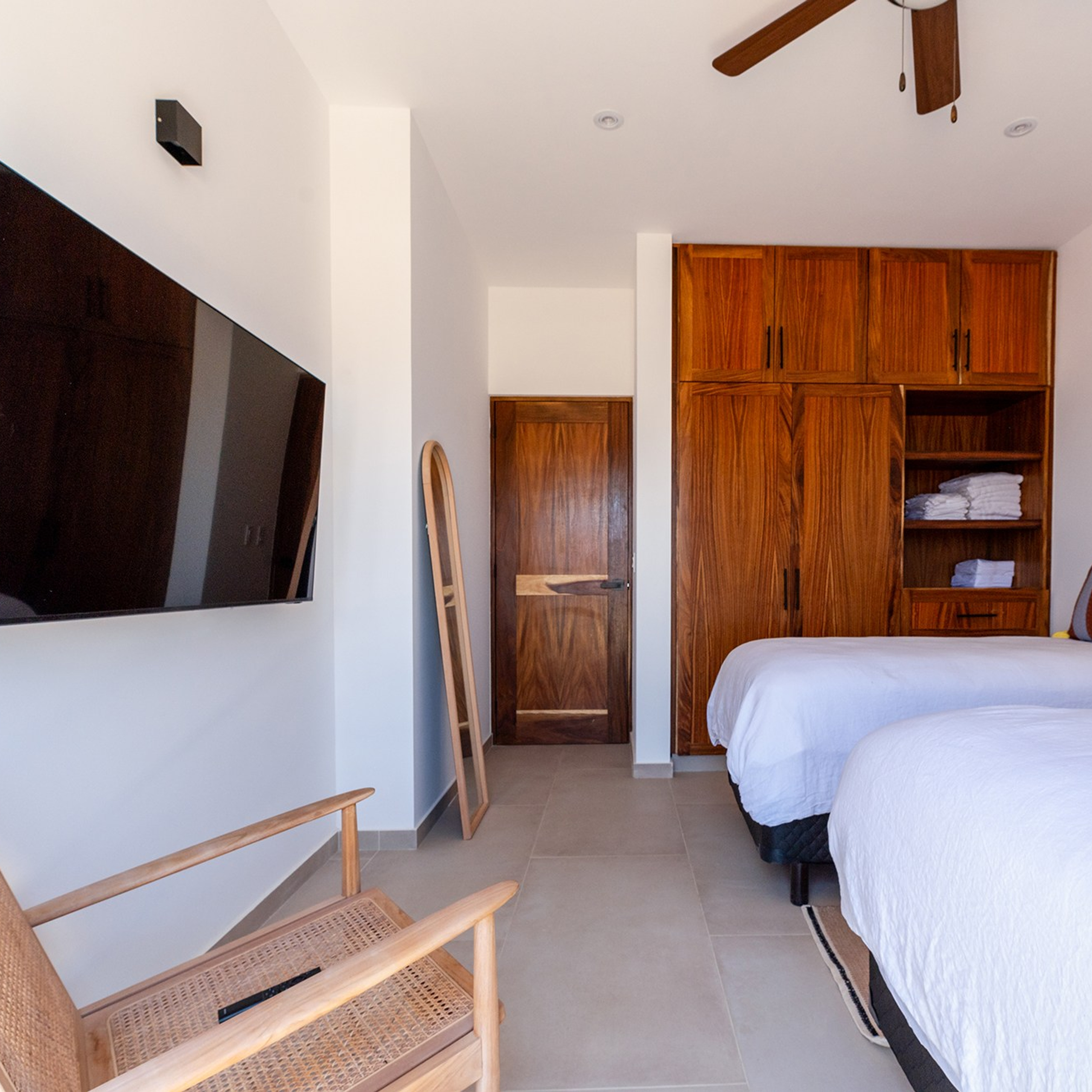 Bedroom with neutral tones and soft lighting in Cerritos beach house for rent