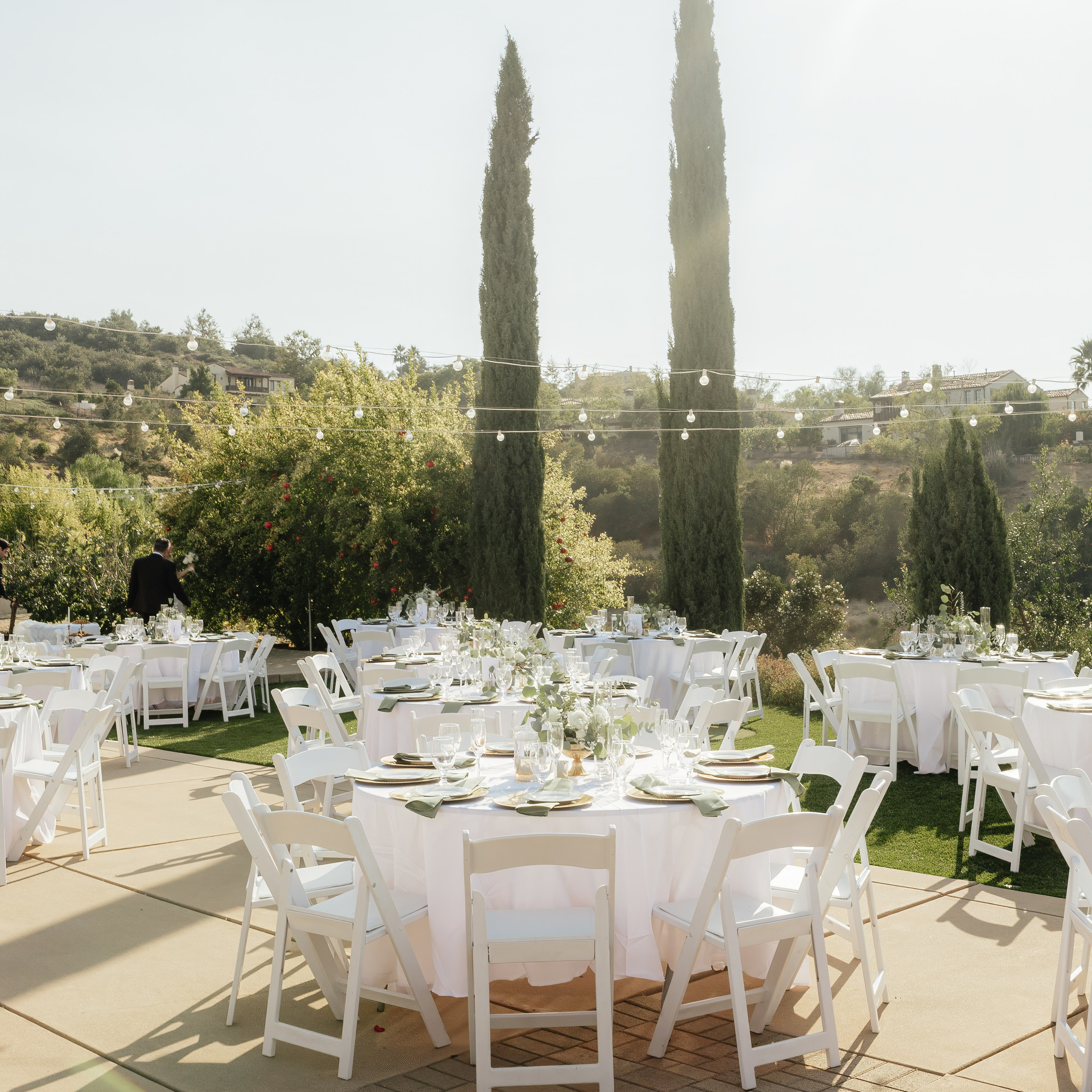 Wide view of wedding ceremony setup with decorated tables and chairs in Chicago