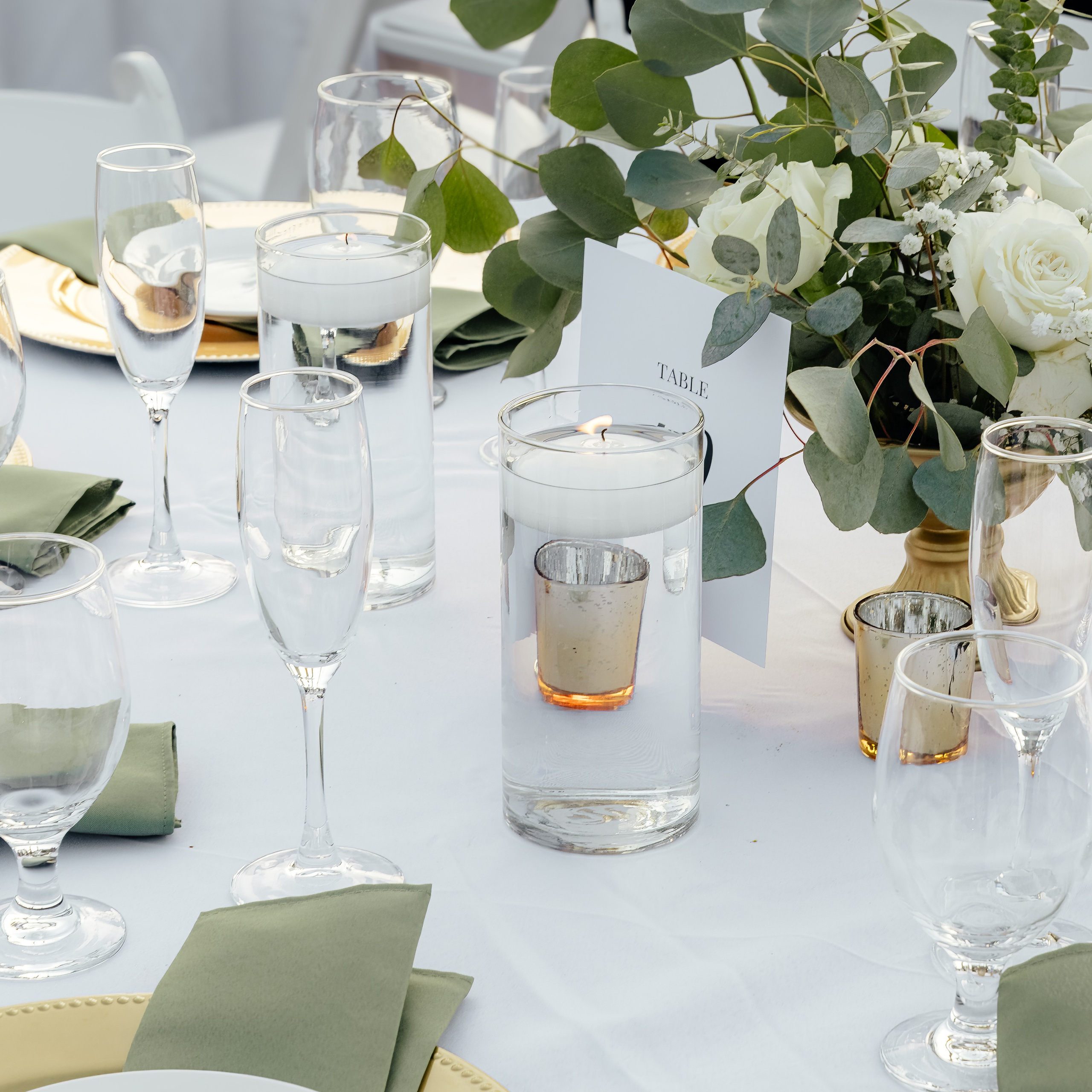 Table setting with floral centerpiece at wedding reception in Chicago
