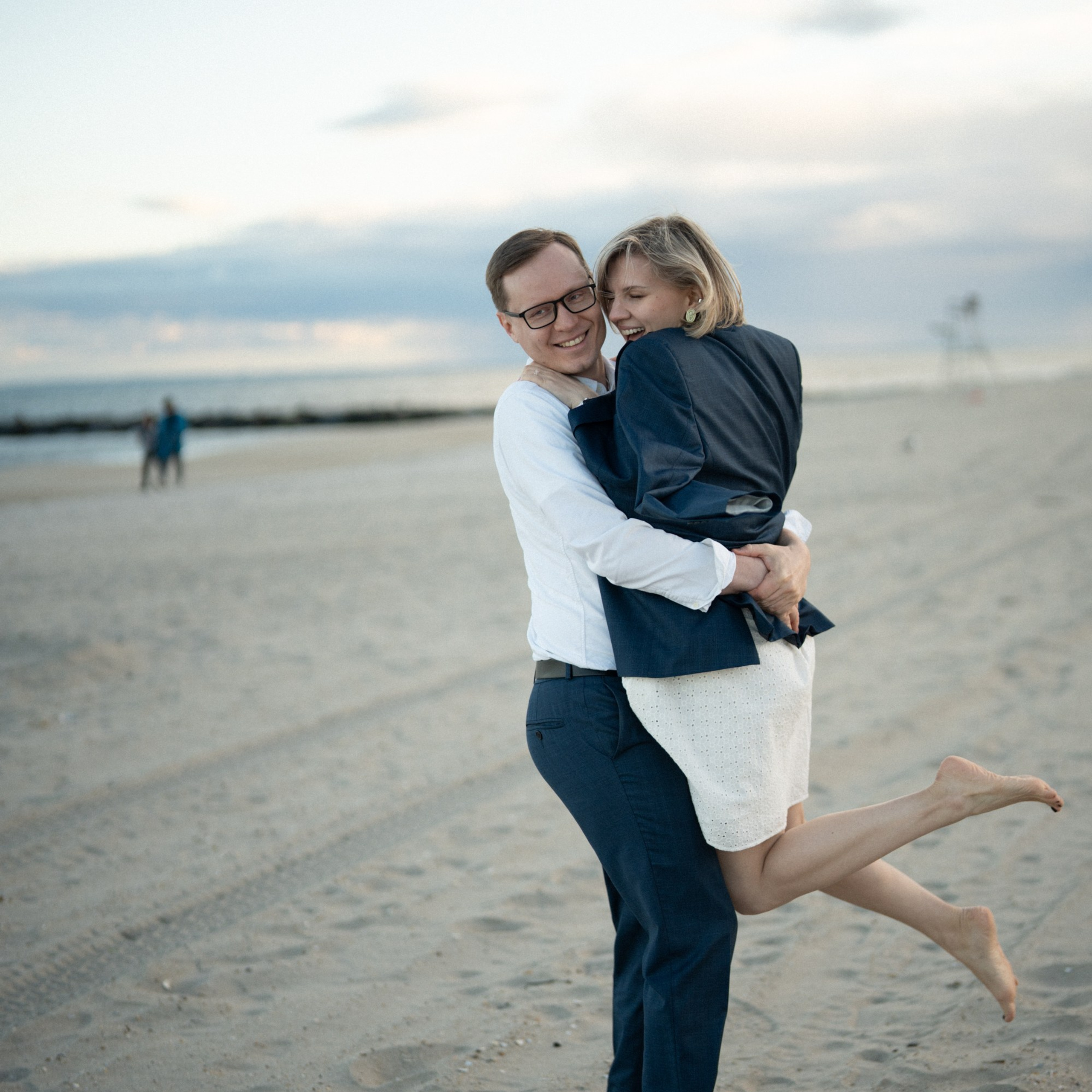 Candid photos of a couple on the beach