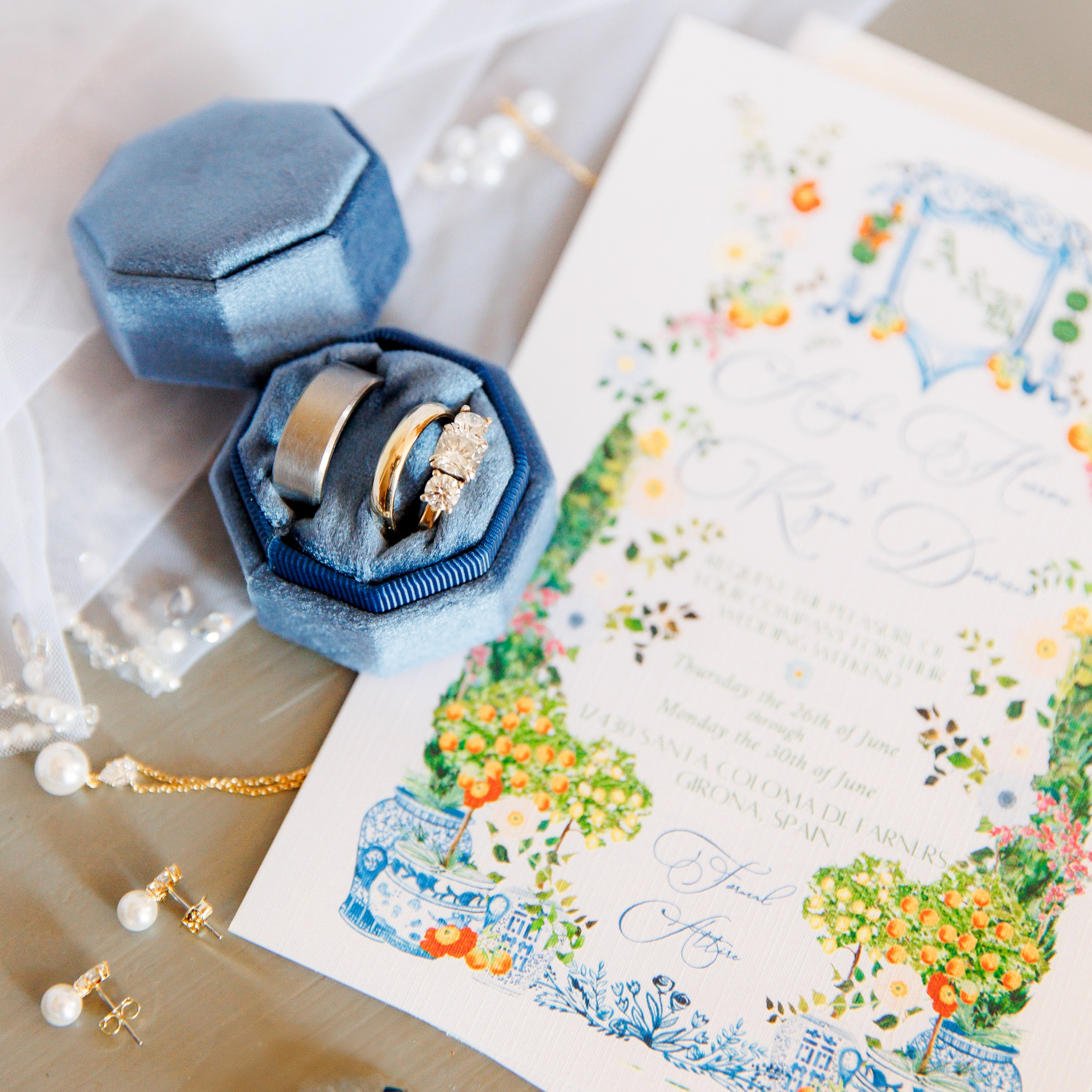 Wedding details such as rings, invitation cards, veil and bridal bouquet 