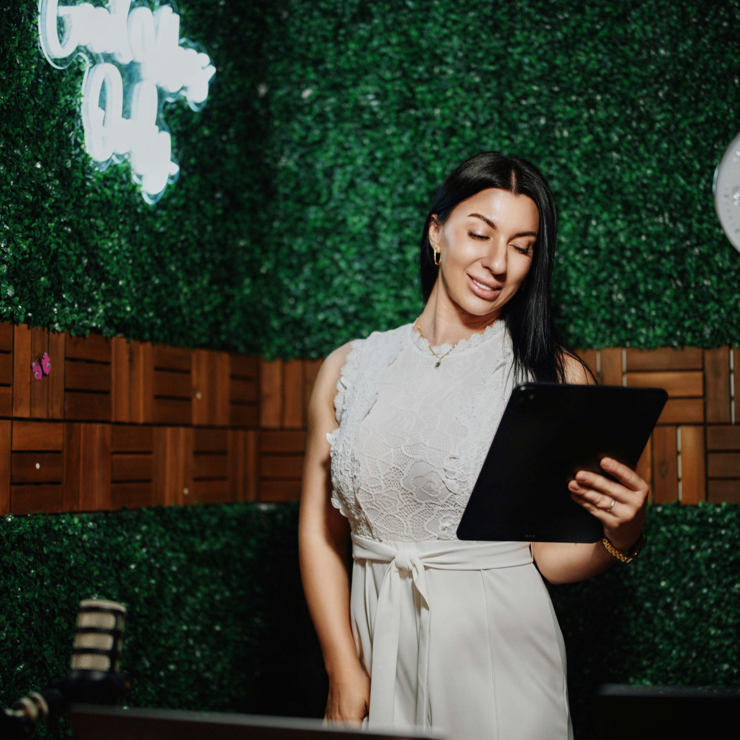 Host presenting in the Good Vibes studio set at ProStudio1 in Hollywood, FL (near Miami) — ideal for podcasts, interviews, and creator videos.