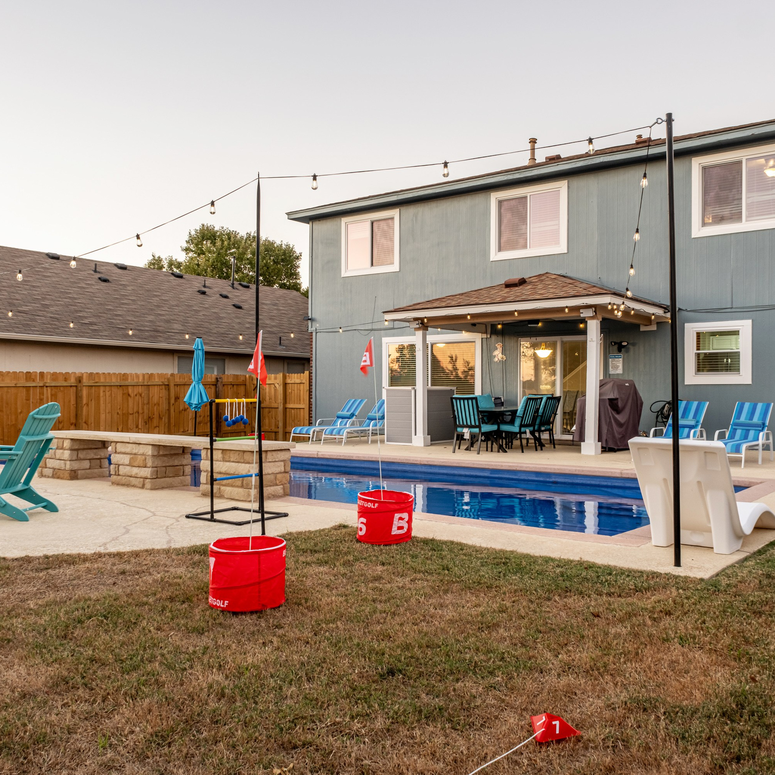 Modern two-story house with backyard pool photographed by Austin real estate photographer