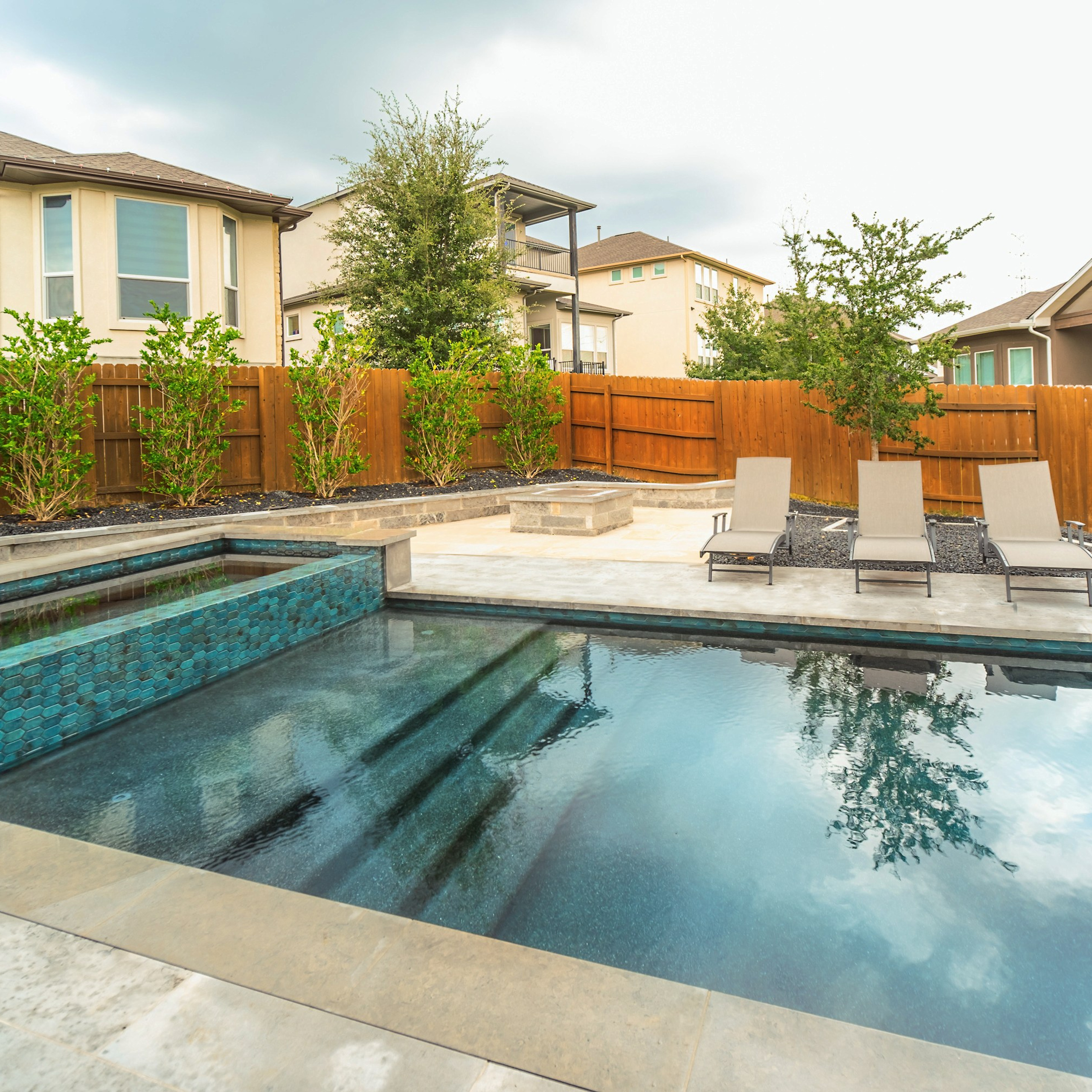Modern two-story house with backyard pool photographed by Austin real estate photographer