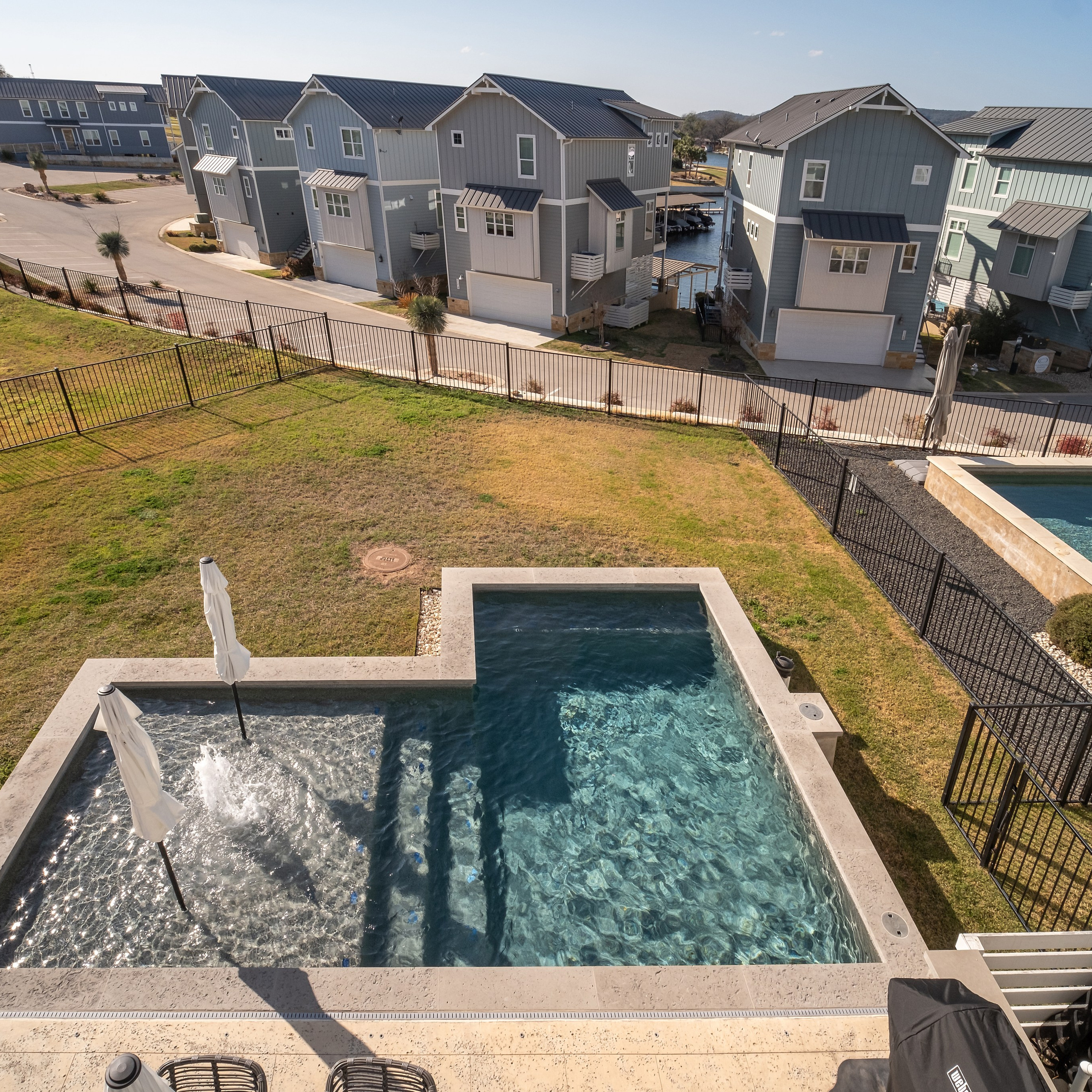 Modern two-story house with backyard pool photographed by Austin real estate photographer