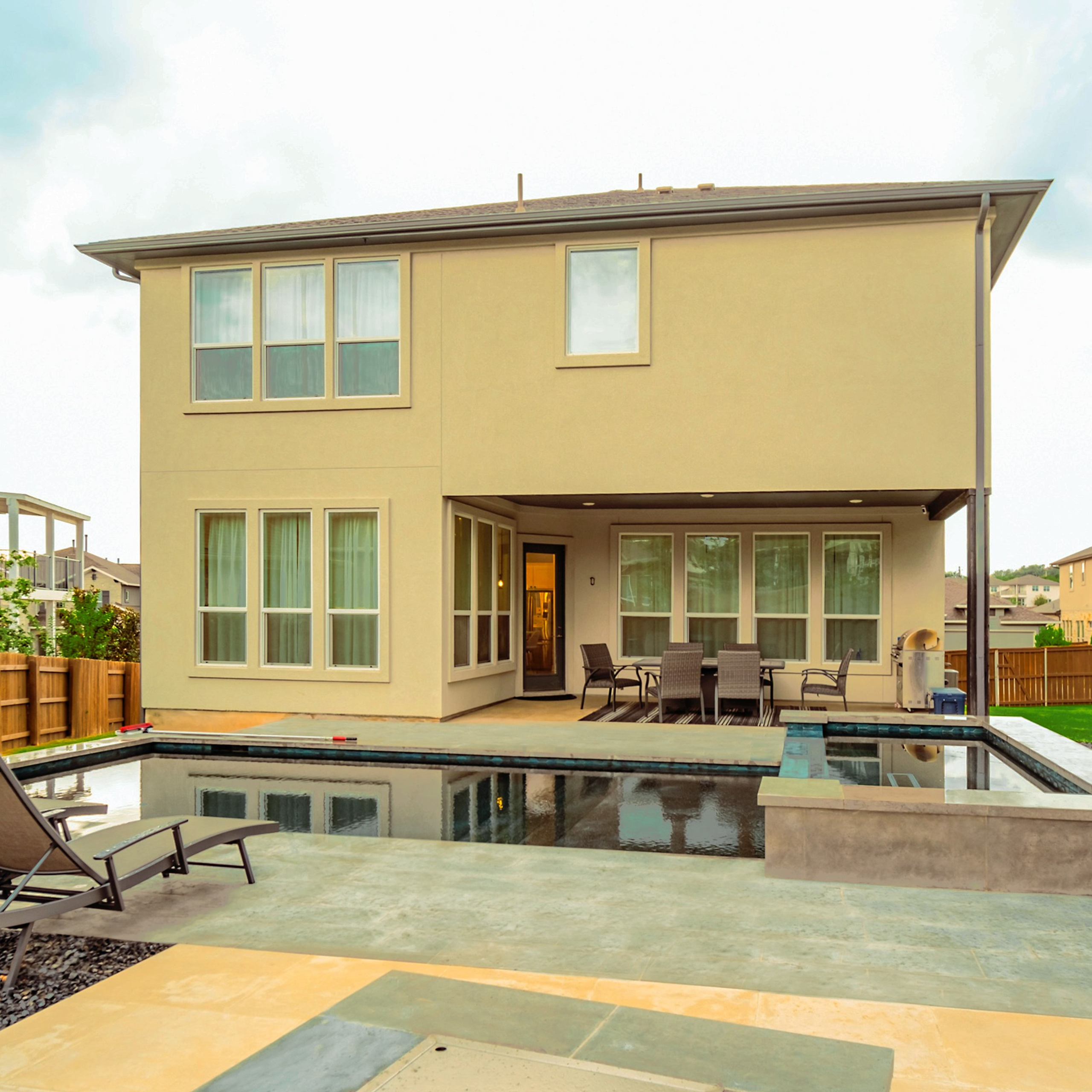 Modern two-story house with backyard pool photographed by Austin real estate photographer