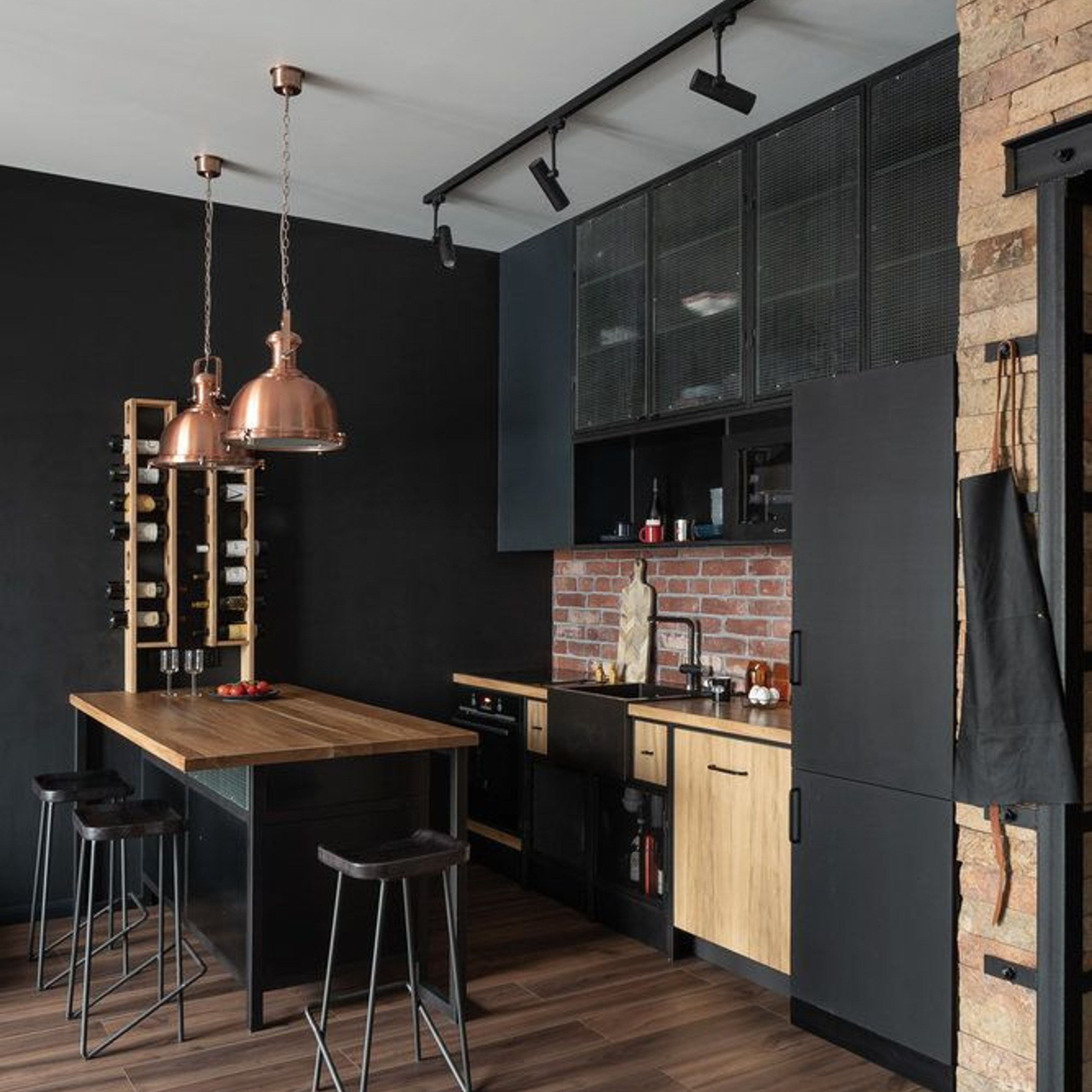 Modern kitchen featuring dark wood accents, a central island with bar stools, and warm-toned lighting